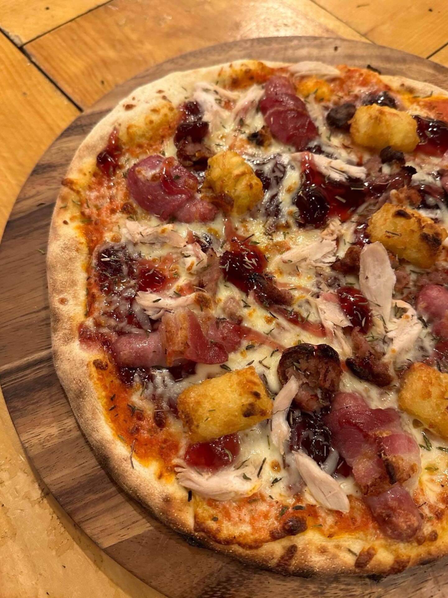 Join us for our last pizza night of 2025 🍕
Our pizza tonight is a classic; roast turkey, pigs in blanket, tots, stuffing, finished with cranberry sauce.
Want a slice of the action? Give us a call to book or order for takeaway!