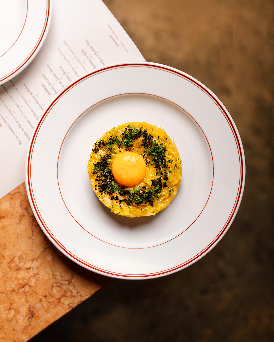 Bacalhau à Brás com gema confitada. É servido?
--
Salted Cod “à Brás” with confit egg yolk. Is it served?