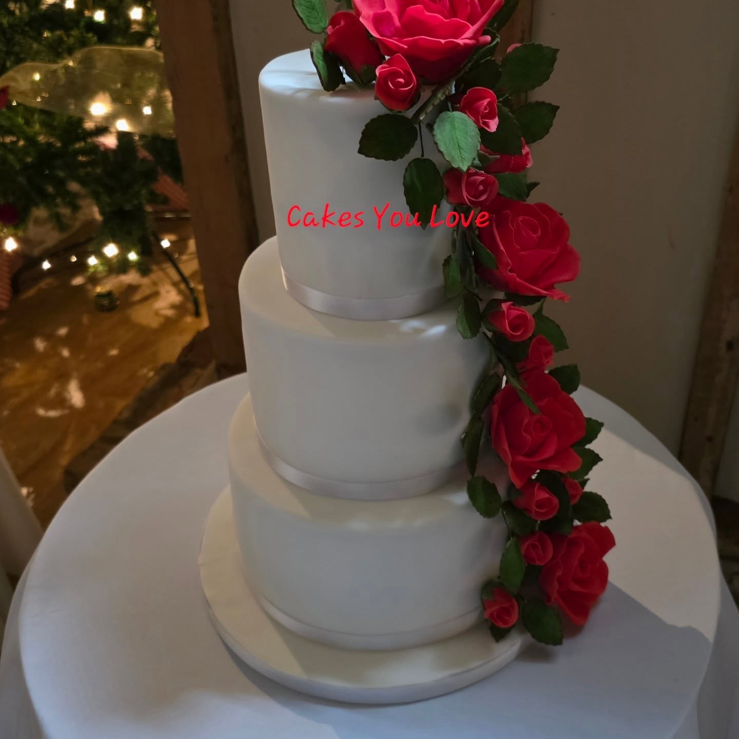 A three tier wedding cake delivered to @combemanorbarns. All roses and leaves are handmade and added to the cake at the venue. The route to the venue is quite hilly, so the cake arrives in separate boxes and not decorated at all. I fully set up at the venues