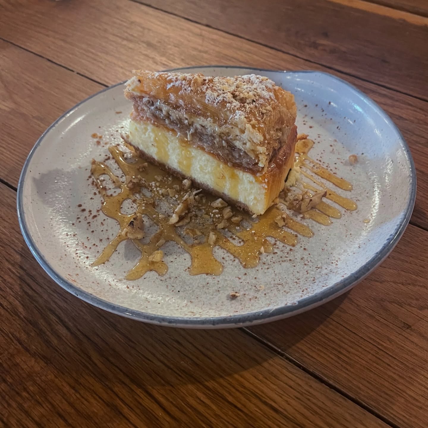 One of our specials tonight is our cheesecake baklava: a decadent holiday fusion of crisp phyllo layers, crushed walnuts, and a creamy blend of feta, manouri and Greek yogurt, finished with fragrant honey rose water syrup. Available in-house only, while supplies last.