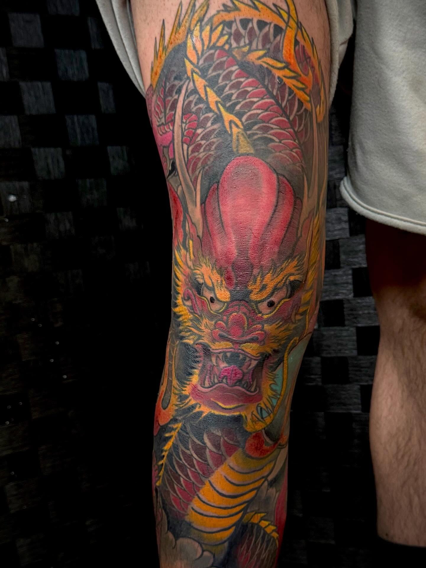 This fierce Japanese dragon now roars with bold colors across this leg, guarding with strength and fire. It was an honor to bring this legendary piece to life and watch it come alive in vivid detail. #DragonTattoo #JapaneseArt #TattooArtist” #truegrittattoosnewmexico#albquerque