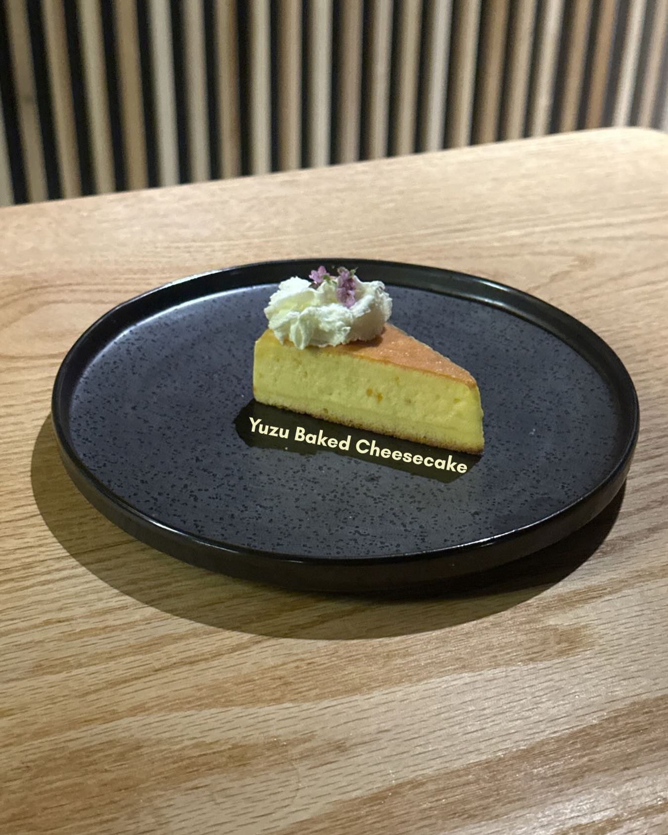 Yuzu baked cheesecake with bright citrus notes and a soft, creamy texture.