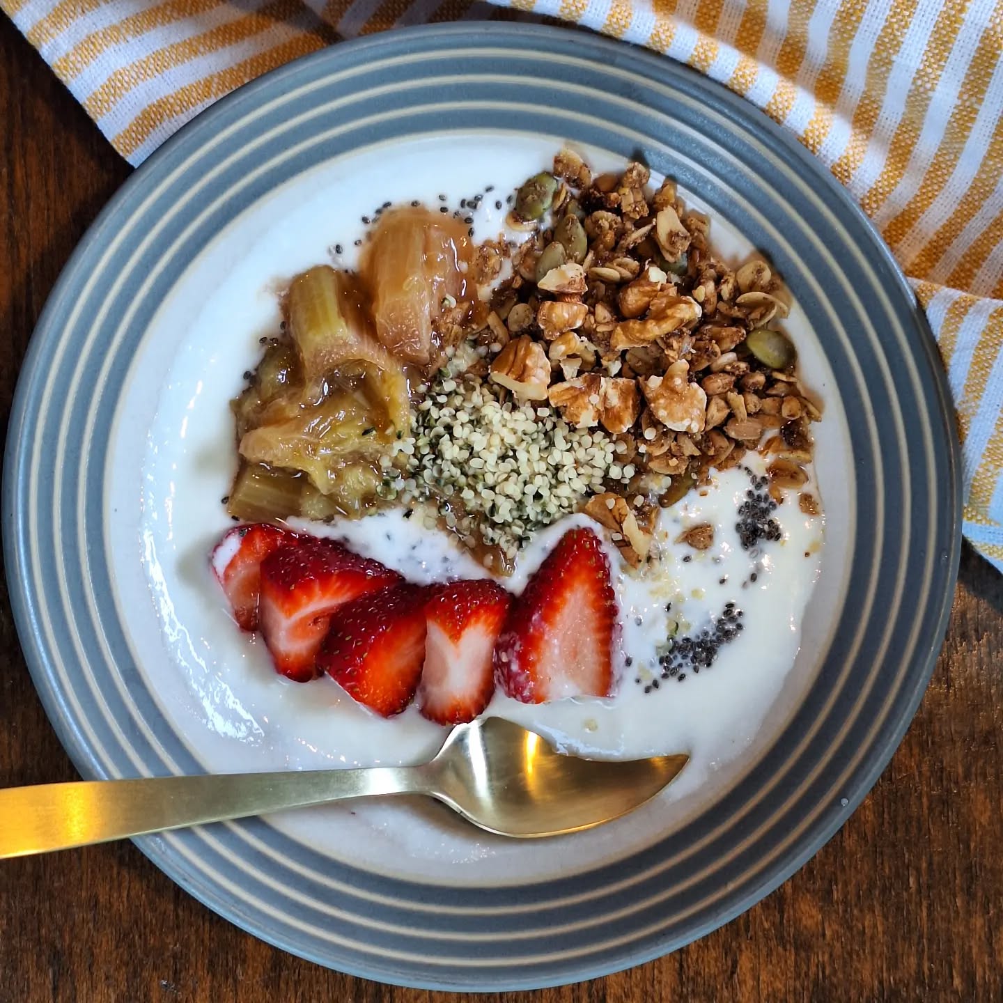 Breakfast time! Kefir, homemade granola, and walnuts, chia seeds, and hemp hearts for a boost of fiber, protein and omega-3's. Topped with strawberries and stewed rhubarb from my garden.
Rhubarb is high in fiber, vitamin K, and is rich in polyphenols, a plant compound that has both antioxidant and anti-inflammatory properties. Polyphenols are good for your gut health (they feed the beneficial bacteria) and may help protect against heart disease.
Pick some rhubarb up at your local farmer's market and stew it, roast it with fresh ginger and honey, pickle it, or add it to your baking.