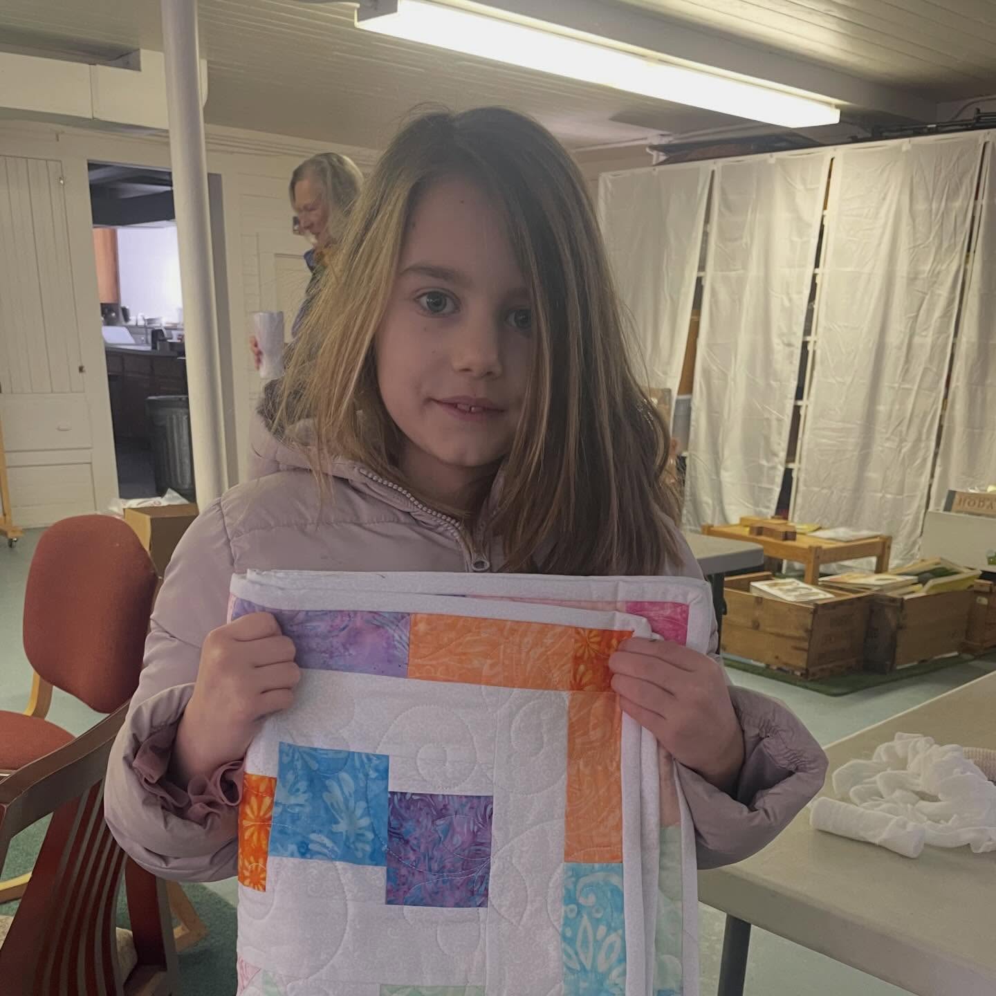 Our crib quilt raffle winner came today to pick up her prize. She promised to share it with her baby sister. Thank you to everyone who bought tickets for this beautiful quilt!