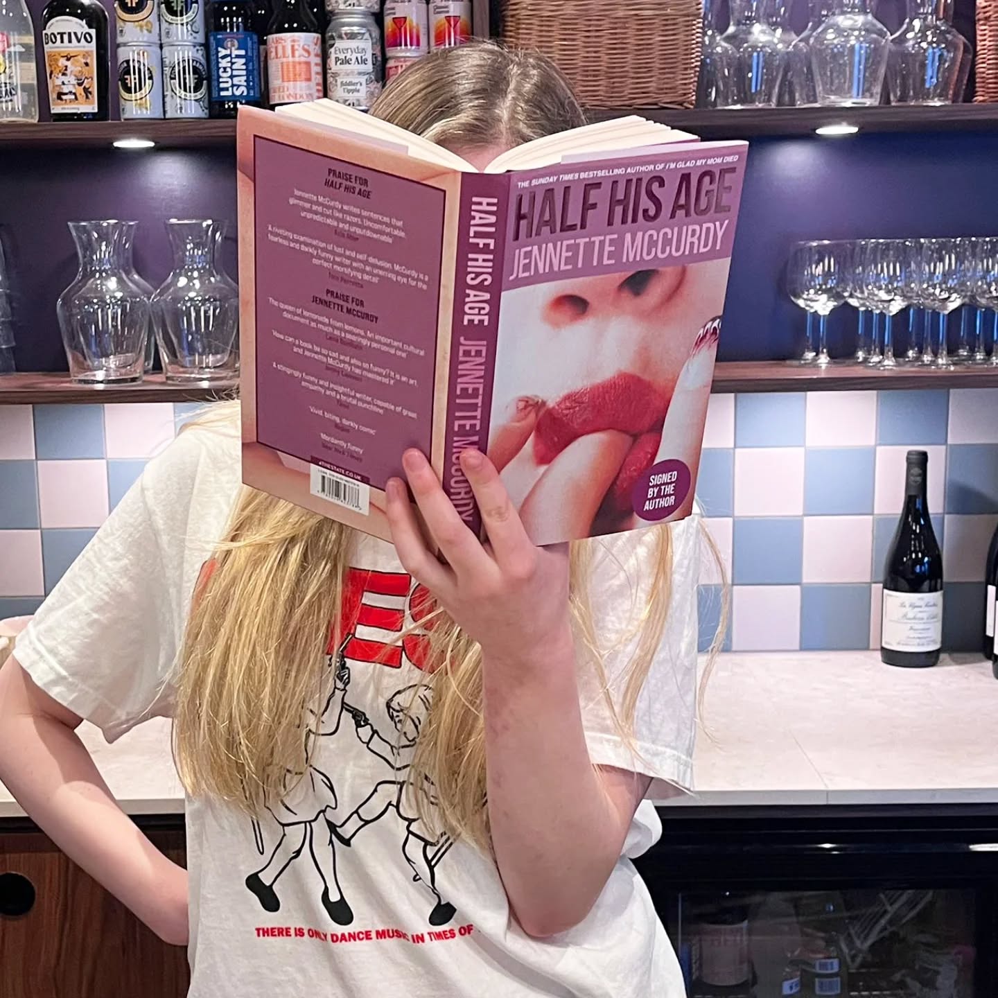 The new Jennette McCurdy is here and she is SIGNED!
The author of cult hit I'm Glad My Mom Died returns with her debut novel, Half His Age, a story of hunger, desire, love and sex that's receiving rave reviews.
Waldo is ravenous. Horny. Blunt. Naive. Wise. Impulsive. Lonely. Angry. Hurting. Endlessly wanting. And the thing she wants most of all? Mr. Korgy, her creative writing teacher.
Mr Korgy, with the wife and the kid and the mortgage and the bills, with the dead dreams and the atrophied looks and the growing paunch. She doesn’t know why she wants him. Is it his passion? His life experience? The fact that he knows books and films that she doesn’t? Or are they actually kindred spirits, sharing the same filter with which they each take in the world around them? Or, perhaps, it’s just enough that he sees her when no one else does.
Startlingly perceptive, mordantly funny, and keenly poignant, Half His Age is an incisive study of a yearning seventeen-year-old who disregards all obstacles in her effort to be seen, to be desired and to be loved.
Head to either of our shops or order online to grab your copy while they last!