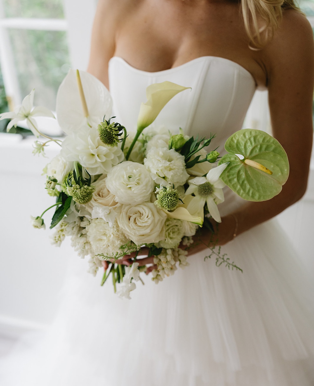 An effortlessly chic bouquet for the effortlessly chic bride
Made with love using a dreamy mix of white calla lilies, andromeda, lisianthus, dahlias and ranunculus, green anthuriums and scabiosa, and perfected with flannel flower and bridal fern.
If you’re a 2026 or 2027 bride and this is your dream bouquet, we’d love to chat!