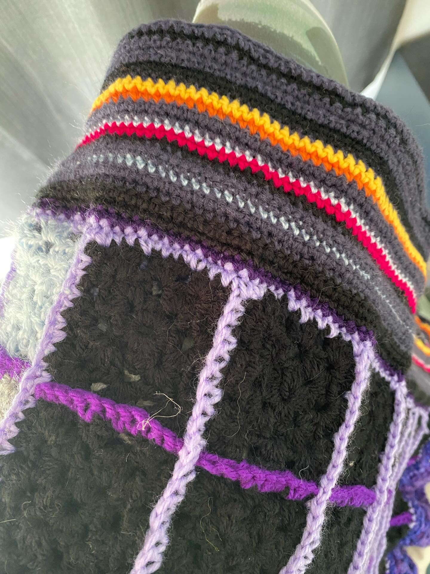 I have decided to add a border to my granny square quilt that shows different shades of migraine days. I only used black, different shades of grey, light blue and white for the different intensity of pain for the granny squares. In the border I decided I would use black for the worst days where I function only due to pharmaceuticals, a dark grey for days where I am still impaired but can function, light blue for better days and different colours of the rainbow for days with no migraine pain. One row of single crochet a day. You can see what January 2026 has been like so far. #migrainedisease #migrainewarrior #dailypractice #crochetcalendar #arttherapy