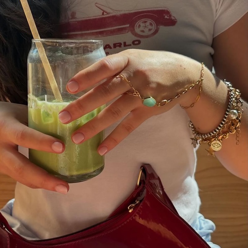 @smithxjade wearing a simple jade hand chain and a cutie charm bracelet looking unbelievable 🥝