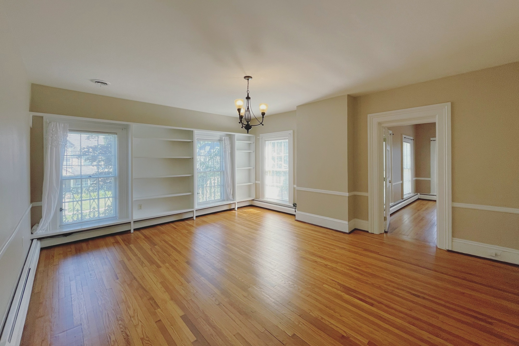 Spacious & sunny two-bedroom apartment that occupies the entire second floor of a beautiful historic Italianate-styled home! Entering from the grand foyer, the apartment enters into a central hallway where you'll find a massive living room adorned with built-in bookshelves, as well as a quaint bonus room perfect for use as an office or additional storage. The primary bedroom boasts a massive walk-in closet with an incredible amount of storage space. The designer kitchen features updated appliances (including a dishwasher), oak cabinetry, and tiled floors and backsplash. The bathroom also features a great deal of custom tile work, in addition to a glass-door tub & shower, and spacious linen closet. The secondary bedroom is also quite spacious, with its closet containing a washer & dryer, and a rear entrance down to a cozy balcony overlooking the backyard. Other features of this incredible apartment include custom light fixtures, hardwood or tile flooring throughout, central air, and off-street parking available. This meticulously maintained apartment rents for $1295 + gas and electric.
** To apply for this apartment or for a showing, please submit an application at capriottiproperties.com **
#apartment #apartmentforrent #apartmentliving #balcony #bookshelves #builtin #capriottiproperties #crownmolding #downtownelmira #elmiradowntown #elmirany #fireplace #highceilings #historicapartments #historicarchitecture #historicnearwestside #historicneighborhood #historicrenovation #historicrestoration #interiordesign #italianate #italianatearchitecture #largewindows #luxuryapartments #nearwestside #victorianapartment #victorianarchitecture #victorianhouse #victorianhome