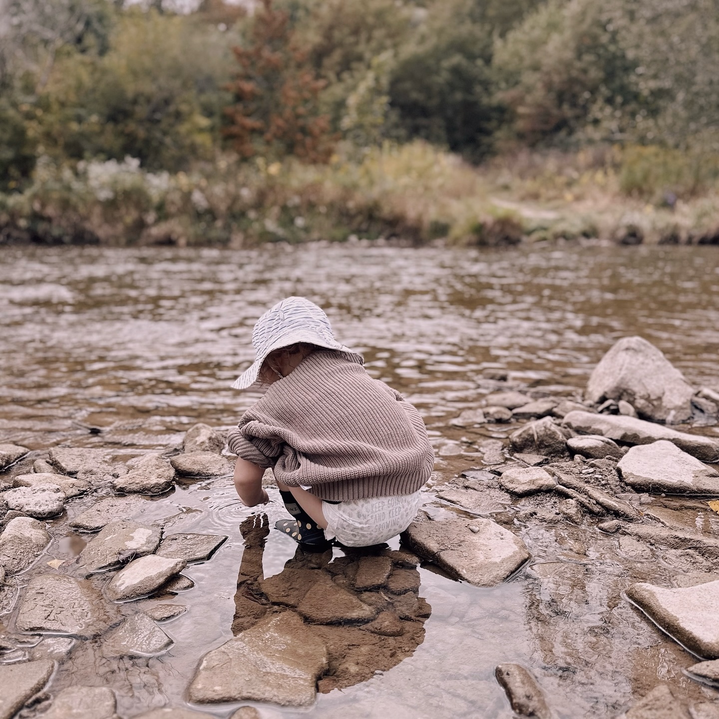 A little river scientist searching for her next big find. #homegrowntomatoes #outdoorexploring #rockyriverbeds #lookingfortadpoles #salamandersmaybe #childcare #nanny #nannyshare #daycare #torontobeachesdaycare #homedaycare #keepgoingandkeepgrowing