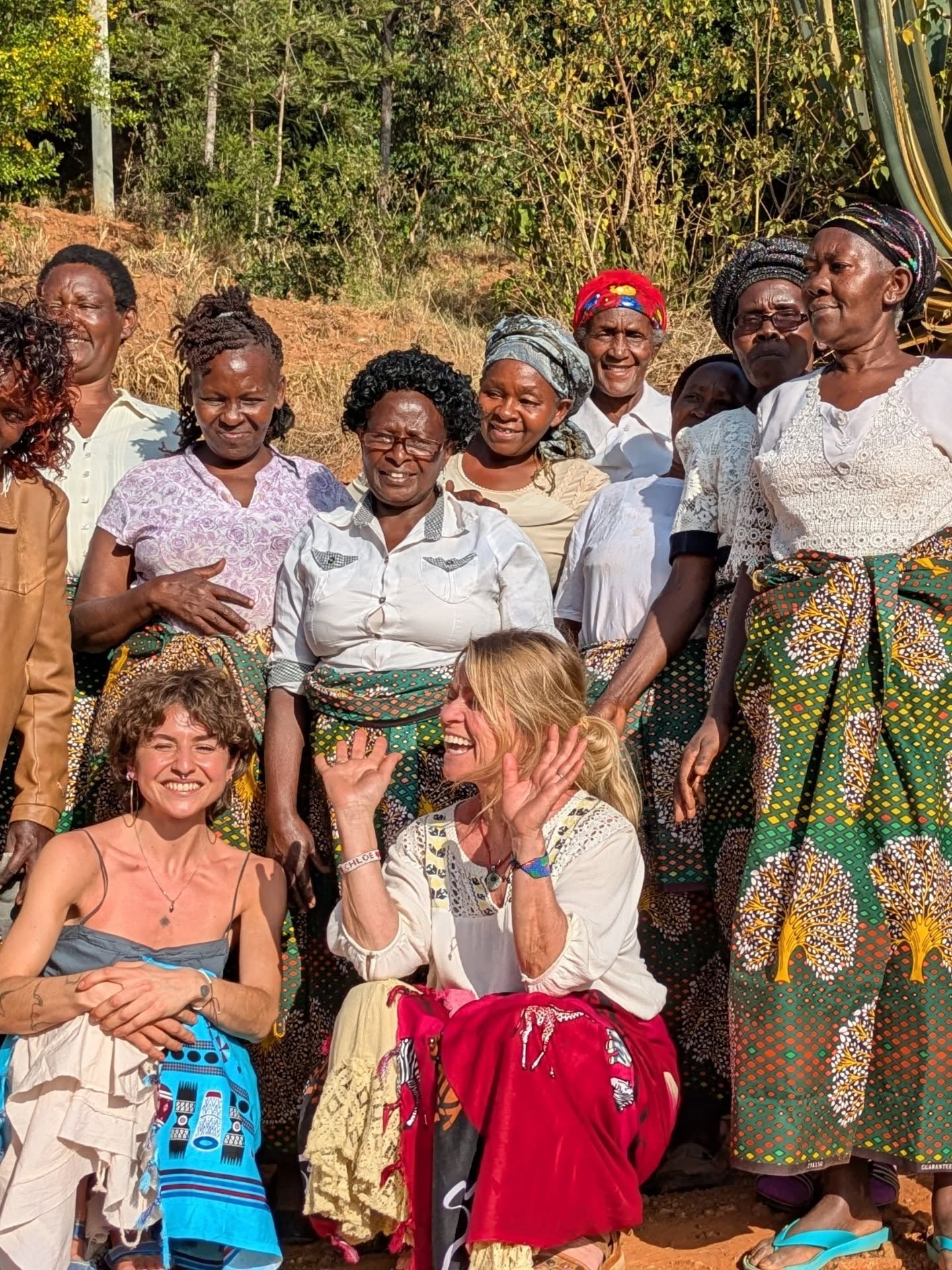 We had the most incredible welcome we could have ever imagined.
Huge hugs. Singing. Drums beating as we walked up the hill together to one woman’s home. Bottle tops jangling around waists — hypnotic.
We cooked on an open African fire, chopping not on boards but with our bare hands.
Thirty women cooking together. Talking. Laughing. Sharing stories. Not everyone spoke the same language, yet somehow we all understood.
We even talked about laundry.
No miles between us.
Just women — together, connected by weaving and love. 🪡🤍🔥