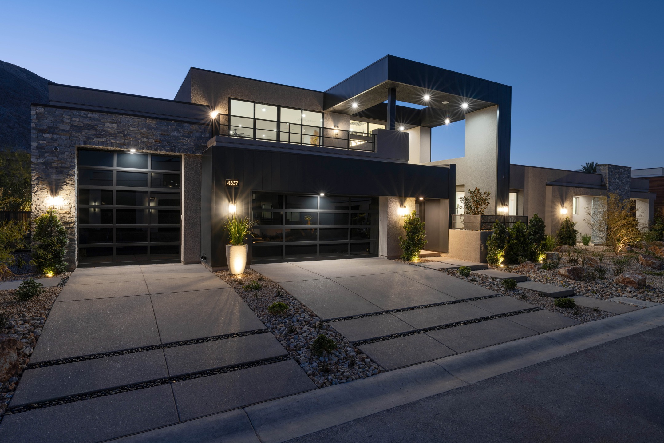 Night time at the Spire Plan🔥
The home's modern exterior showcases metal-clad and natural stone accents, while the interior embraces a refined industrial design that balances warmth with a touch of edge.
4 Bed | 4.5 Bath | 4,569Sqft | Half-Acre Lot Size
On the Market
TheEstatesatLoneMountain.com