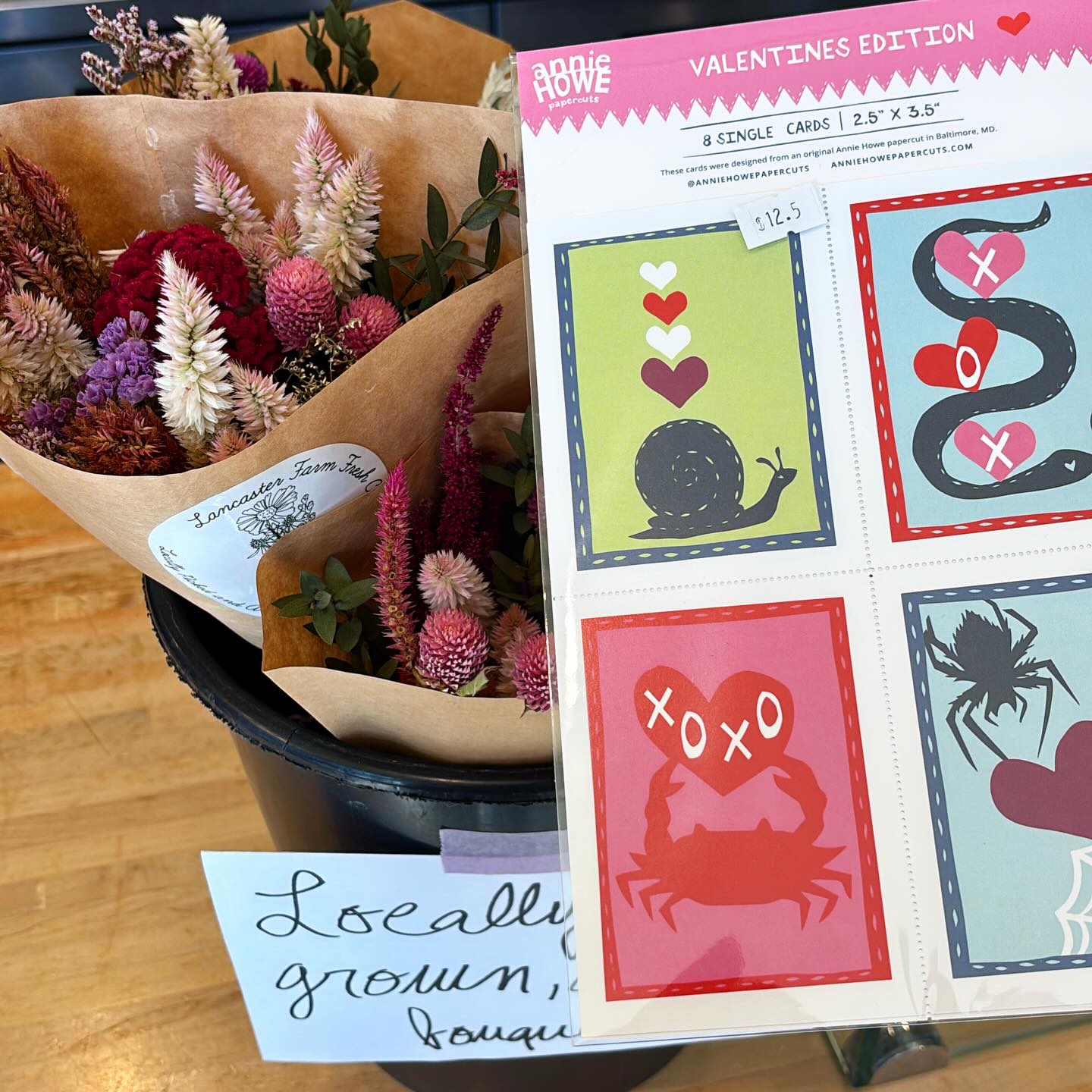 We have Valentines galore from @anniehowepapercuts & everlasting local bouquets from @lancasterfarmfresh along with retail shelf gift ideas! 💌💗💜🩷♥️