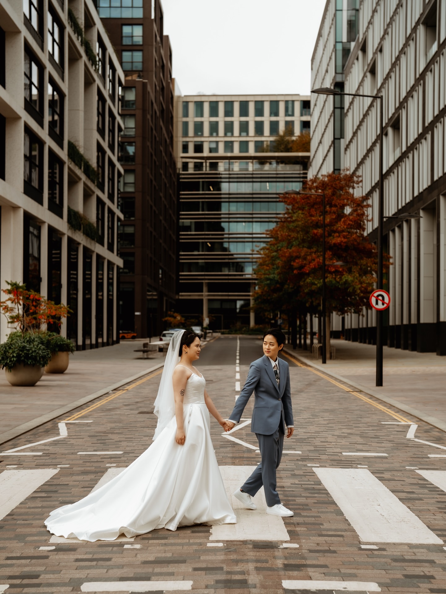 London looks good on them 🖤
There is a specific kind of magic found in a city elopement. It’s the way the world keeps moving around you while everything for you stands perfectly still. It’s the contrast of a white dress against industrial brick, and the sound of a bustling city fading into the background of a quiet walk.
For Mandy (she/her) & Yui (she/her), we wanted to capture that exact energy - a documentary-meets-editorial stroll through the heart of Coal Drops Yard.
We spent the time between their ceremony and dinner seeking out the architectural lines and hidden corners that make London so iconic. No grand ballrooms or rigid timelines, just the rhythm of the city and the freedom to stop wherever the light hit just right.
2nd for @stephaniedreamsphotography
#londonelopement #londonweddingphotographer #coaldropsyard #lgbtqweddingphotographer