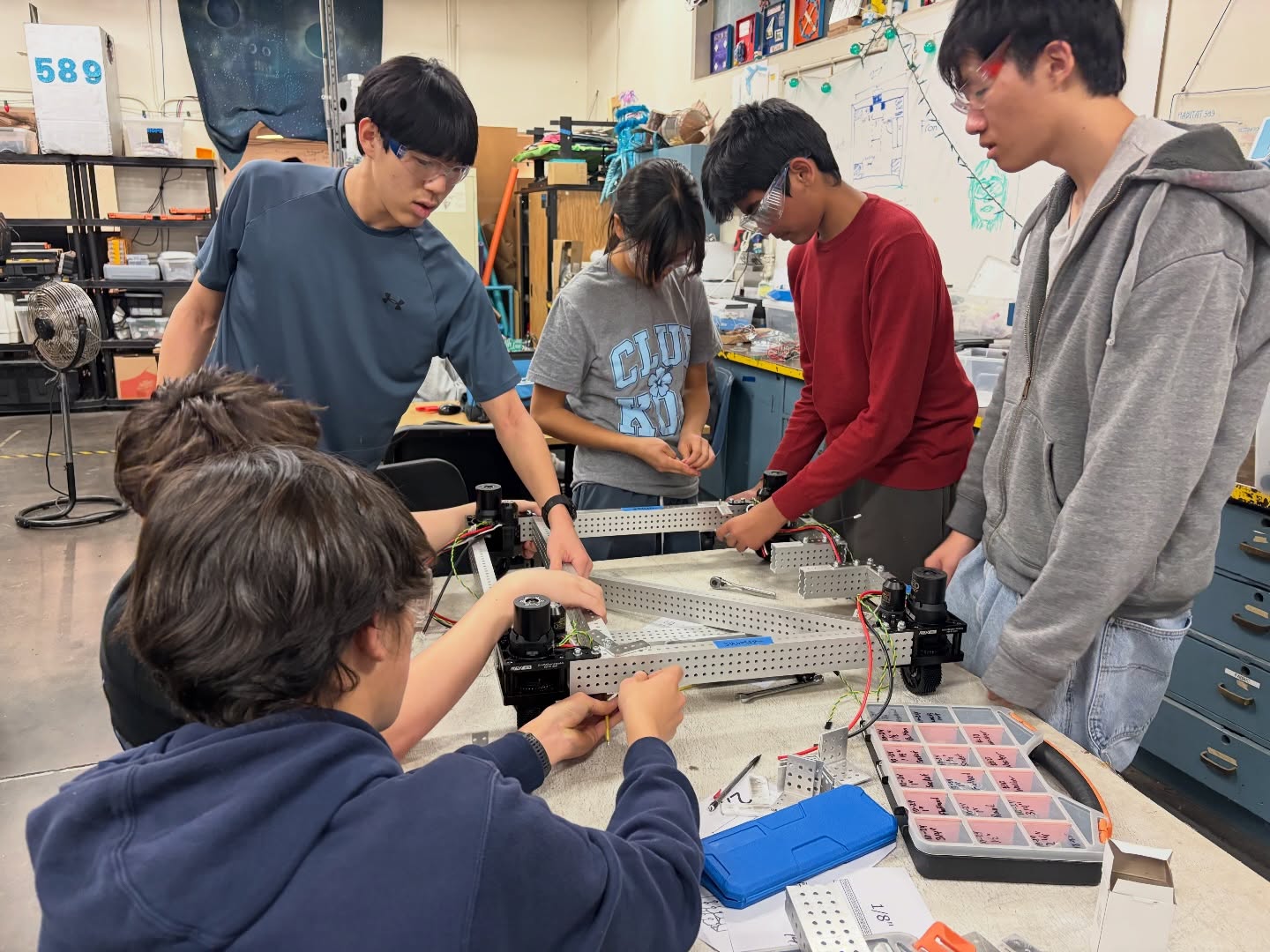 End of week 3!!
This week we are approaching finishing CAD for the climber, intake and shooting mechanisms while also starting prototyping for the shooter. Next week, we will work on assembling the chassis.
Infrastructure finished mounting April tags for software to test robot vision, and also finished cutting wood for bumpers.
Visual strategy team worked on trading cards, scouting team finished the majority of the front end and worked on backend for the scouting app, and award strategy worked on executive summaries and Woodie Flowers.