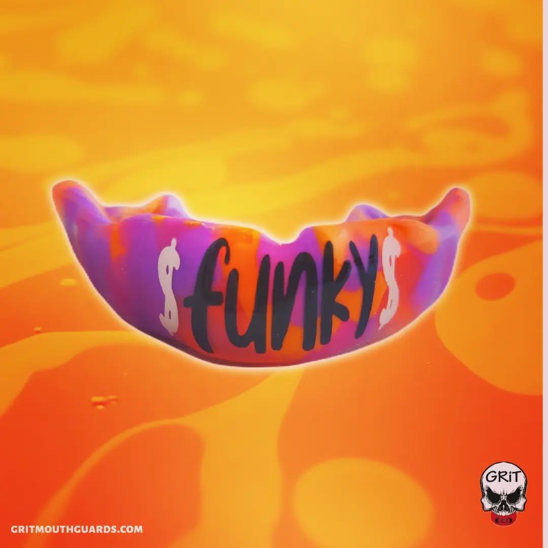 A camo-patterned custom mouthguard in purples & oranges. #gritmouthguards #mouthguards #funkyburd