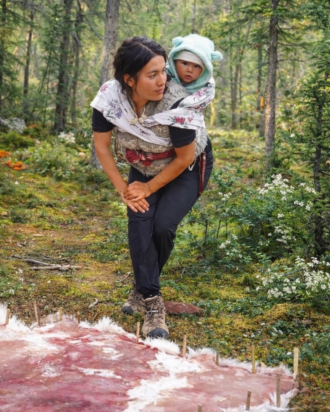 👩🏽🍼Indigenous Motherhood🤰🏽
There is a quiet, powerful beauty in Indigenous mothers working with their babies wrapped close — tiny heartbeats against our backs — while children run barefoot through the rhythm of daily life. This is how work and love and have always moved together. Creation and caregiving, inseparable.
I am a mother of four, and our youngest will soon be three months old. These early months have been fuller and busier than I ever imagined. Hands always moving, hearts always listening. Between the hum of a busy household, I find quiet moments to breastfeed, to breathe, to return to the work. It’s a dance many mothers know well.
Across cultures and across the world, mothers carry this same beauty. We create, we nurture, we provide — often all at once. Our labour is not always seen, but it is deeply felt. Babies grow up to the sound of our work. Children learn resilience by watching our hands work.
My creative practice isn’t just about making beautiful things — it is a way of life. It is about working in a good way. Honouring the land. Honouring the teachings. Honouring the unseen hours behind every finished piece. The tanning of hides, the processing of caribou hair for colouring, the patience, the painful aches, the prayer, the repetition, the sweat and tears at times — this is the real work behind the scenes.
I hold deep gratitude for my husband, who walks beside me in this life. From helping tan hides, to processing caribou hair, to carrying the weight of everyday responsibilities — his support makes this work possible. This is shared labour. Shared vision. Shared love. I love you @caribou.curtis !
To all the mothers — Indigenous and non-Indigenous, those who are creating while raising children, who are doing the unseen work, who are holding families and futures together: I see you! The beauty is not only in what we make, but in how we live, love, and how we somehow just keep going forward…
#HardworkingMothers #indigenousart #hidetanner #denethings