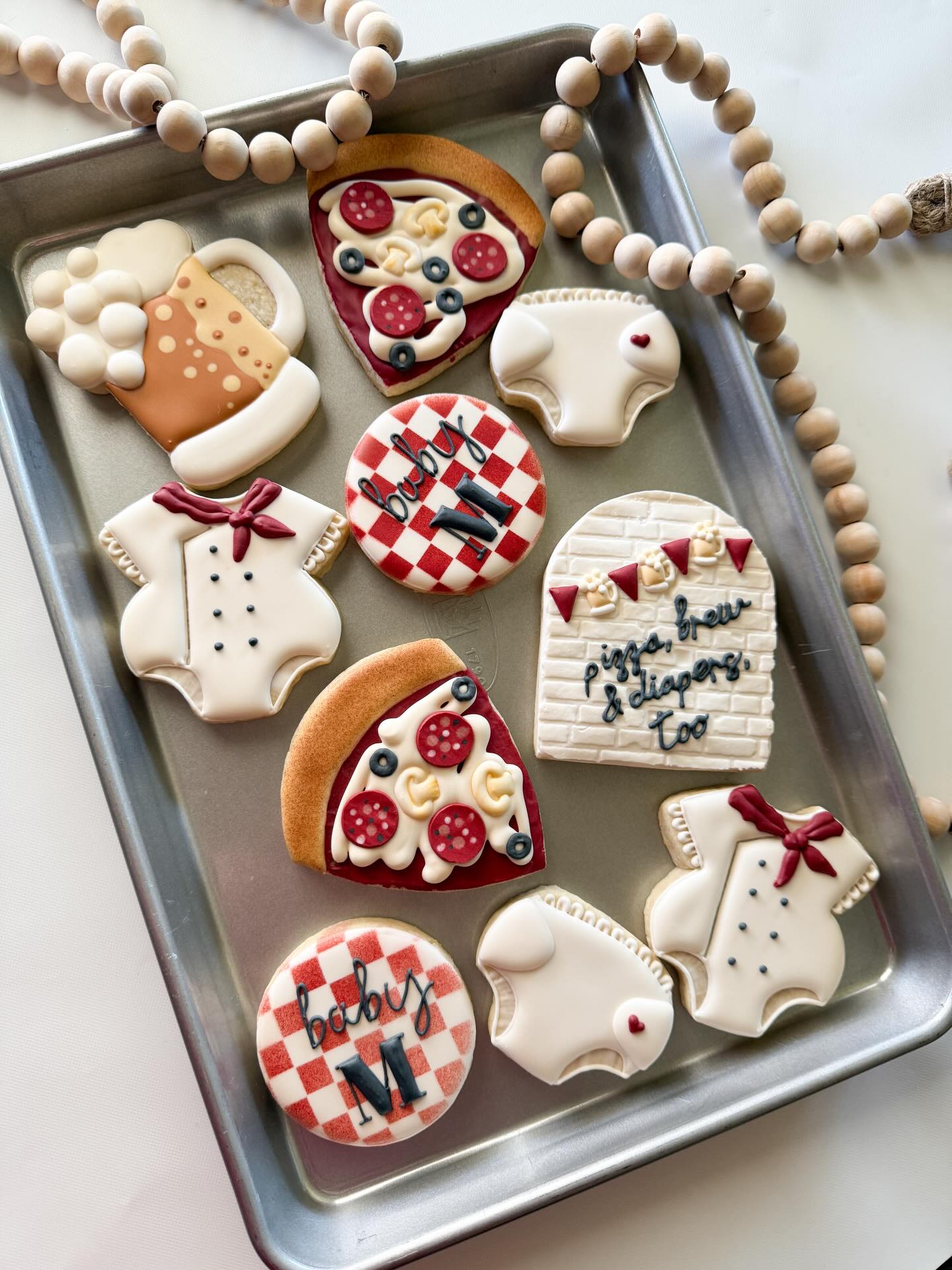 Pizza, brew, and diapers, too! Baby girl onesies, beer mugs, diapers, and pizza slices for a fun diaper keg party 🍕🧷🍺
#decoratedsugarcookies #nebraskabaker #diaperkegcookies #babyshowercookies #pizzacookies