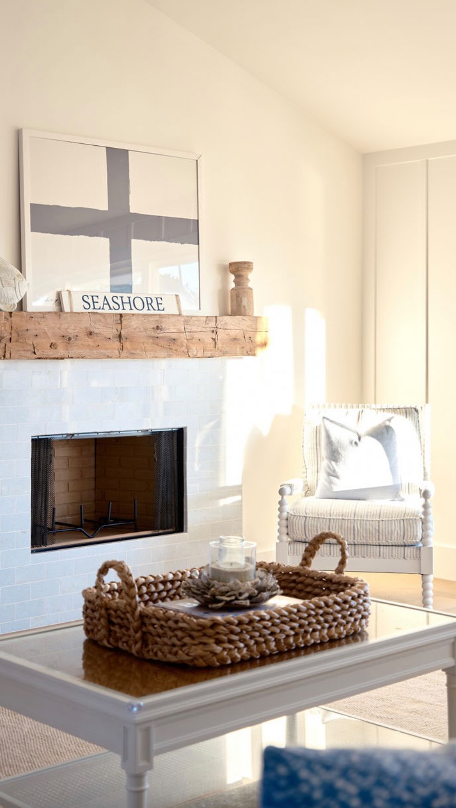 Bathed in warm morning sunlight, this inviting family room opens to the charm of front porch living, where palm trees sway gently in the coastal breeze. It’s a beautiful, welcoming space designed for laughter, connection, and everyday moments—truly the heart of the home where family and memories come together. Design & Build by: @coastaldwelling_designbuild #coastalhome #coronadointeriordesigner #blueandwhiteforever #coastalinteriors #coastalliving