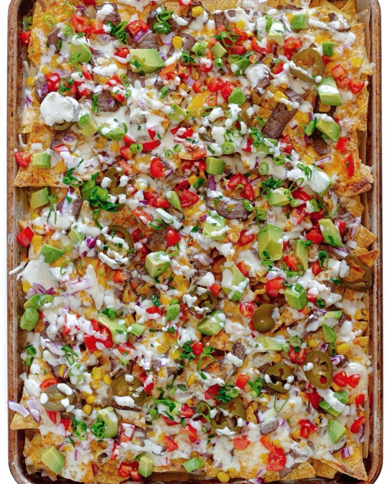 Our Sizzling Nachos have officially made their debut on our delivery menu!
⠀⠀⠀⠀⠀⠀⠀⠀⠀
Thoughtfully layered and generously finished with all the essentials, these nachos were designed to savor each bite. Whether you’re gathered around the kitchen island or enjoying bonfire side, you’ll be thinking of these long after the last bite.
⠀⠀⠀⠀⠀⠀⠀⠀⠀
Choose from our signature proteins, served over crispy tortilla chips and layered with savory refried beans, queso blanco, shredded cheese, and an assortment of fresh garnishes, and a moment for the candied jalapeños.
⠀⠀⠀⠀⠀⠀⠀⠀⠀
Click the link in our bio to order now!