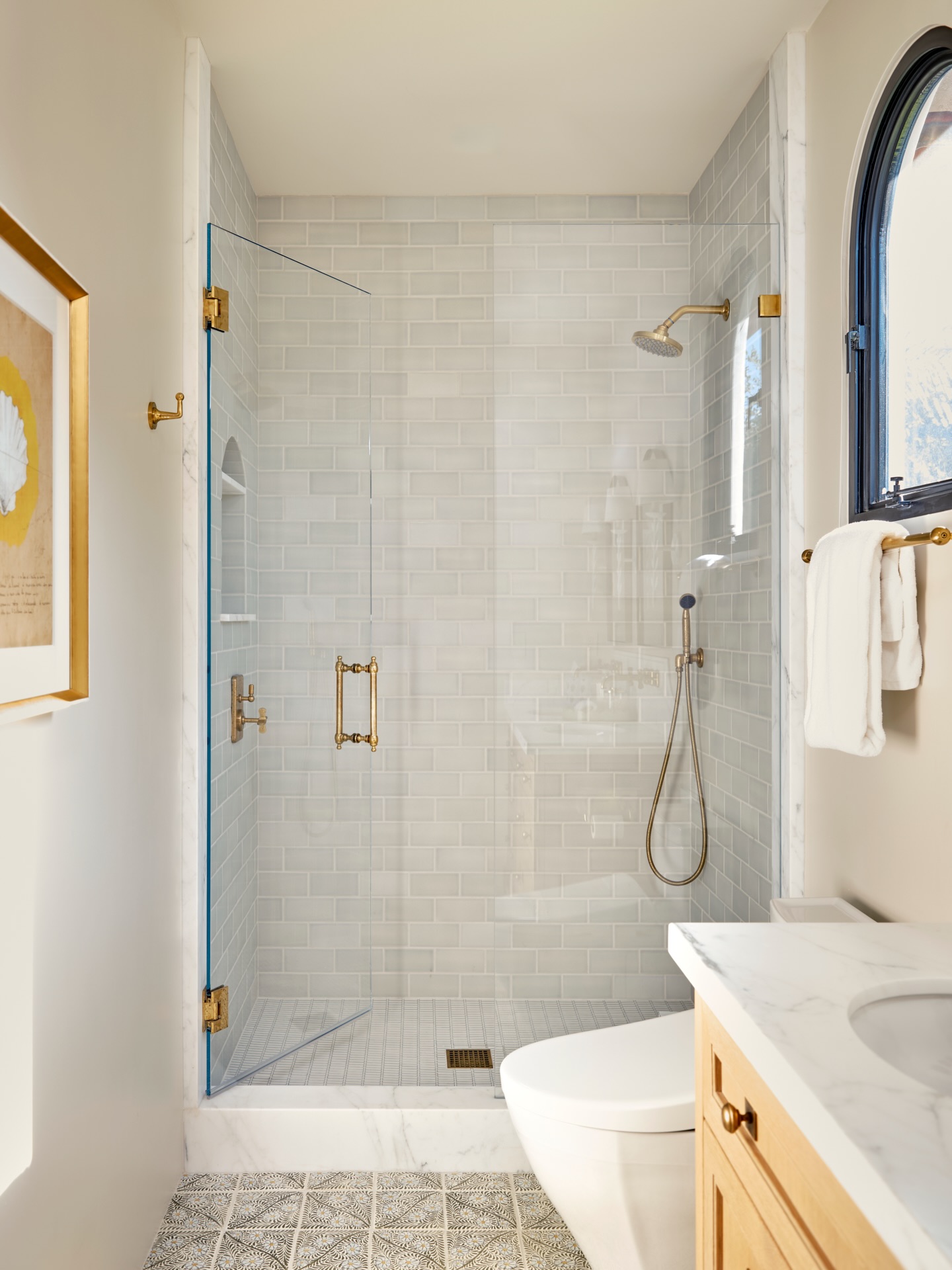 Ready for her close up! We are so obsessed with how this guest bathroom turned out. From the custom hand painted tile floors, to the hydrangea colored glazed shower wall tiles, to the artisan cabinetry and detailing…we just love her! @coastaldwelling_designbuild