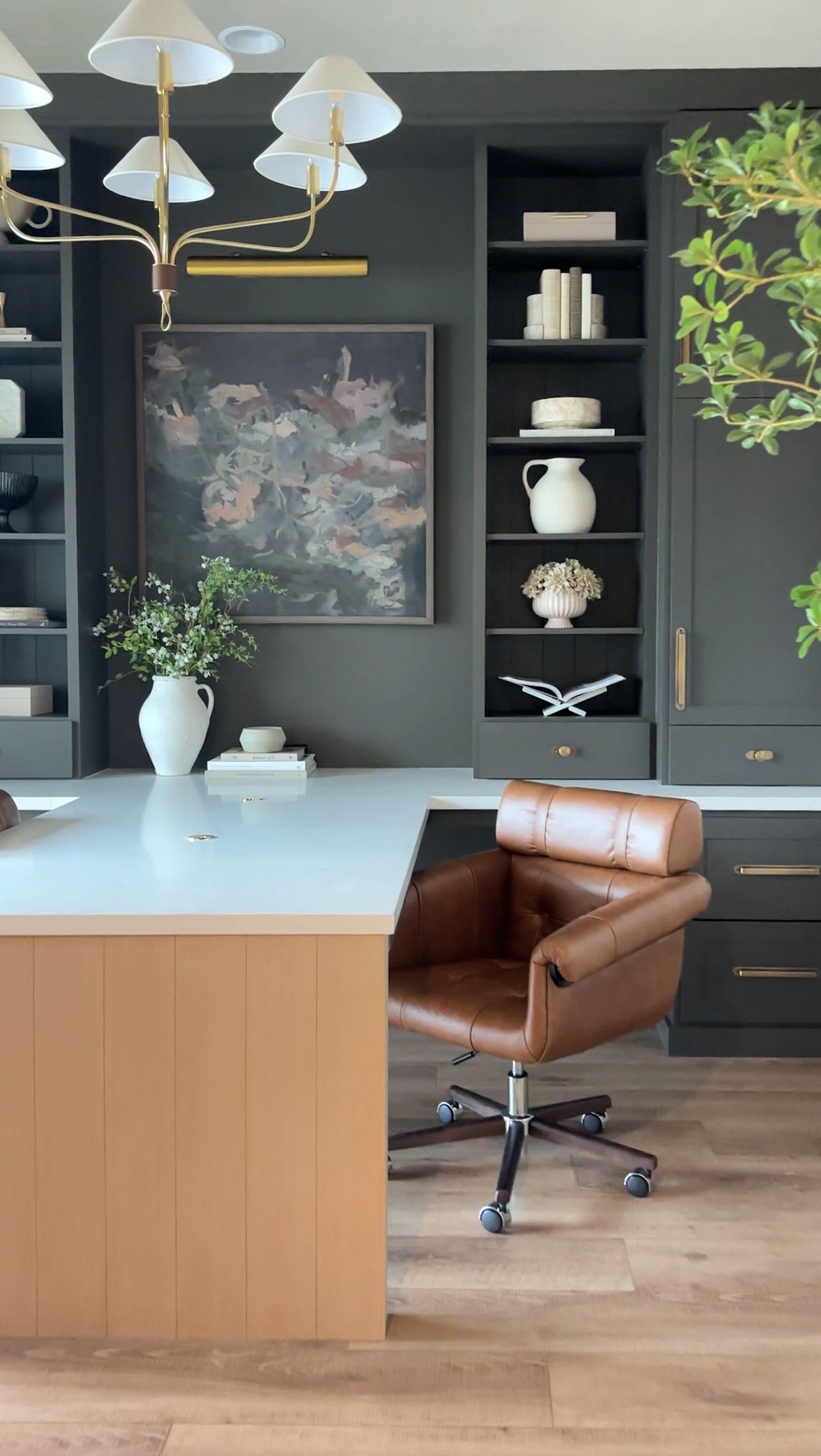 This office was designed to feel grounded, refined, and inspiring all at once. The moody built-ins create depth and drama, the warm leather adds richness, and the brass details bring contrast and warmth against the dark backdrop.
We believe your home office shouldn’t feel like an afterthought. It should feel intentional. Layered. Collected. A space that supports big ideas and everyday productivity.
When your environment feels elevated, you show up differently in it.
If your current setup isn’t inspiring you… it might be time for a redesign.✨ Let us take away the guess work & stress. Reach out today for a design consultation!