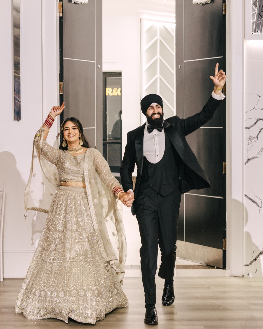 A calm start. A packed room. A perfect entrance. One perfect kind of chaos.
H & T’s reception was pure joy from the portraits to the last song.
…..
@yellowponyproductions
@riccodecor @tailormadetoronto @verdiconventioncentre @skdiamondsco @djdoubles.ca @bar26to @majestic.wrapz @enarabeauty
…..
#weddingreception #punjabiwedding #sikhwedding #torontoweddingphotographer #indianwedding
…..
South Asian wedding reception, Indian wedding reception, Sikh wedding reception, Punjabi wedding reception, Toronto wedding photographer, Toronto wedding videographer, GTA wedding, luxury wedding decor, floral stage backdrop, white rose backdrop, reception decor, candlelit reception, black and white dance floor, reception couple portraits, bride and groom portraits, editorial wedding photography, cinematic wedding film, reception entrance, first dance, cake cutting