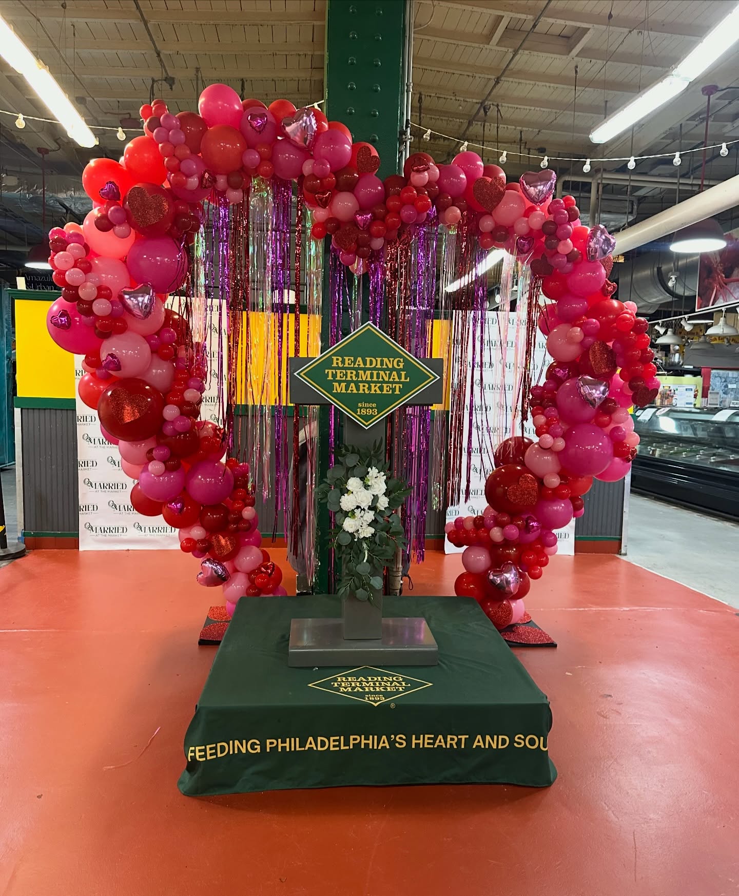 Thank you @rdgterminalmkt for having us for your event, Married at the Market! Congratulations to the 12 newly weds and we wish them a lifetime of love, happiness and prosperity. ❤️
Check out our organic slanted heart display at arch court and be sure to take pictures with your loved ones and tag us at @momentsbymax_ . Display will be up all weekend.
Book us for your next event — inquire to reserve your date!
🛜 www.momentsbymax.com
📧 info@momentsbymax.com
☎️ 267-912-4969
📍 Serving PA, NJ, DE, NY, MD & surrounding areas
.
.
.
#valentinesdayballoons #valentinesdaydecor #phillyballoons #phillyevents #phillystylist