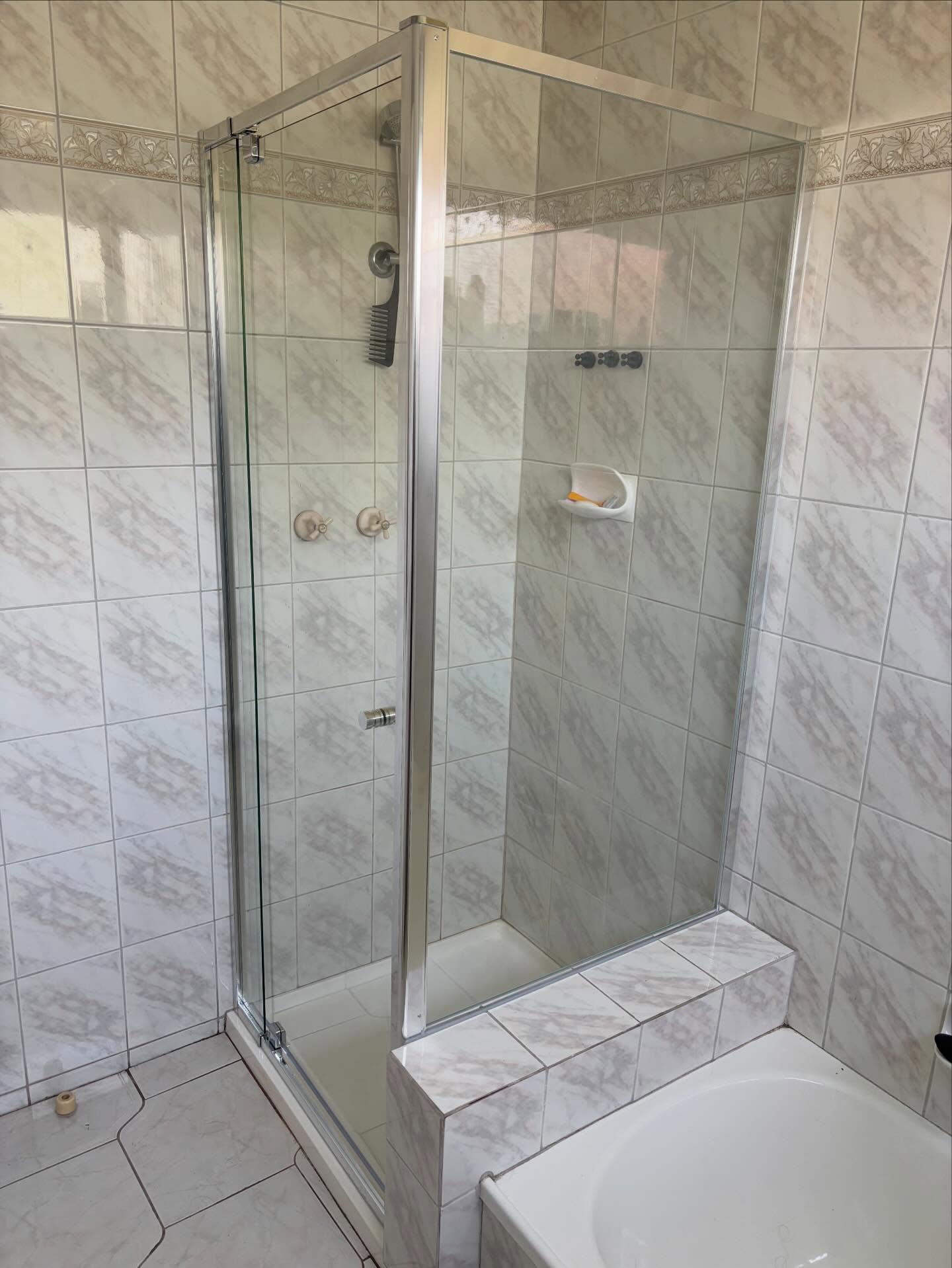 Finished result in Clayton South.
An old and damaged sliding screen, replaced with this modern, pivot door solution with a custom return panel.