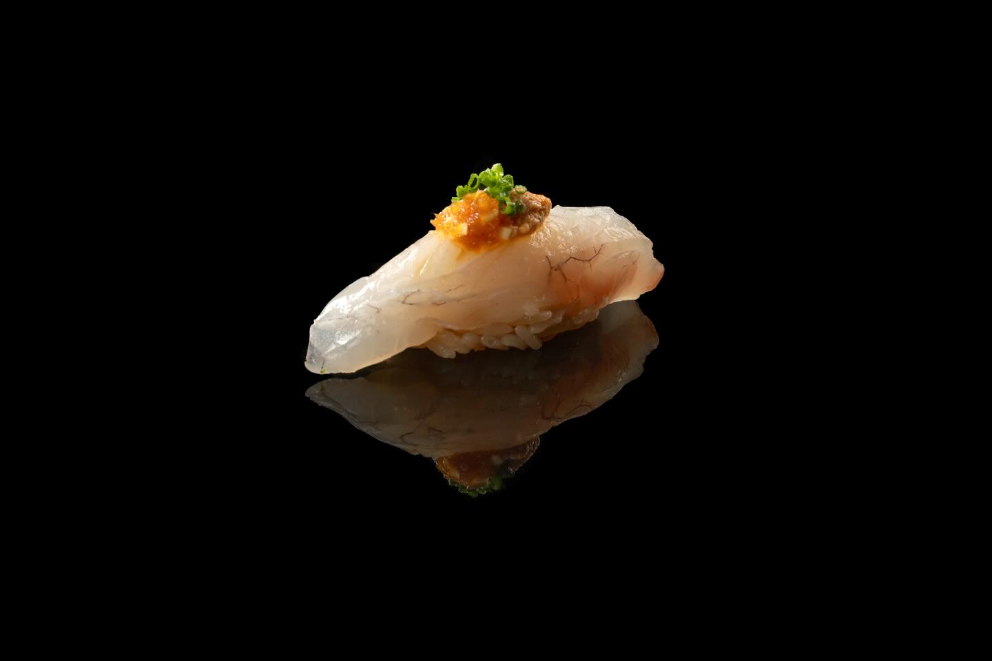 Delicate snapper paired with creamy monkfish liver. A bite of pure umami.