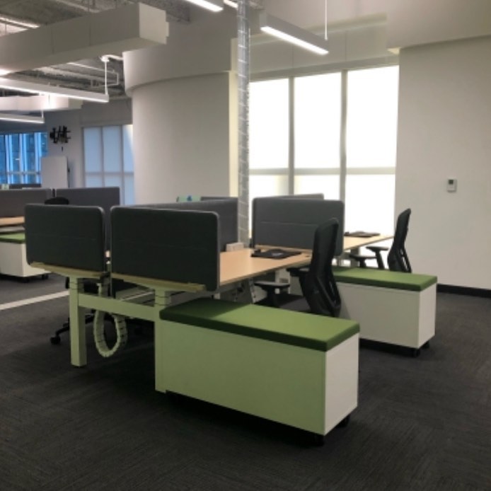 Custom made by Vertical Power Solutions. 8 ft. Round Spiral Sleeve w/ 2 ft. Extension in Gloss white. Photo credit- Peter Eliot. #openofficedesign #workflowinteriors #powerdata #officedesign #officedecor #workstation