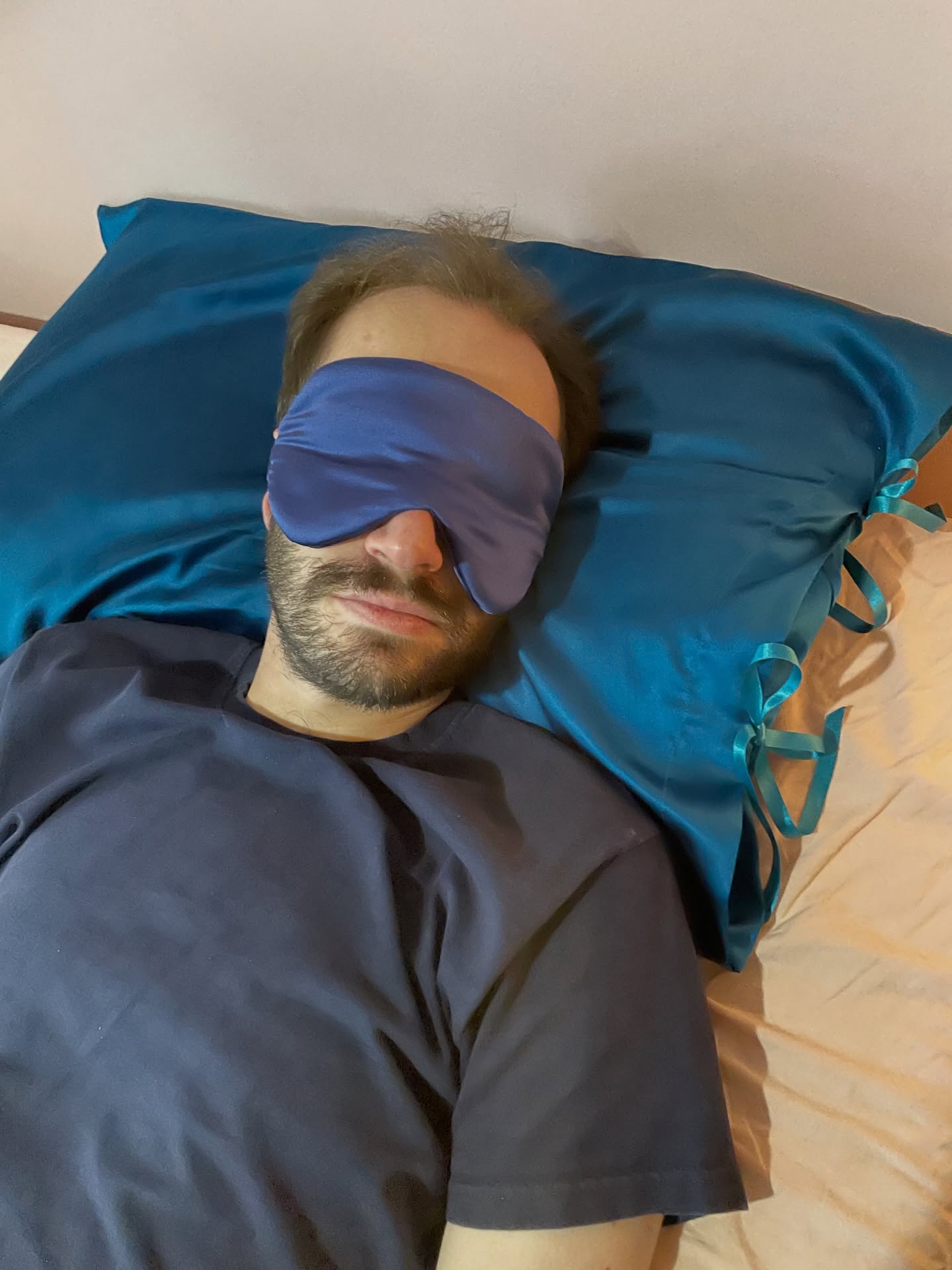 A couple of photos of Raff modelling the new larger silk eye masks (with his new silk pillowcase I sewed him for his birthday)
Everything worn on a head has a sample tested on my head and Raff’s head so it only seemed fair he joined in the eye mask modelling too!
Swipe for one of the outtakes!
Image description- 1. Raff, a half Italian man in his mid thirties, is laying on a teal blue silk pillowcase with his hands on his chest and wearing a large navy blue silk eye mask
2. Raff, a half Italian man in his mid thirties, is laying on a teal blue silk pillowcase and wearing a large navy blue silk sleep mask on his forehead
3. Raff, a half Italian man in his mid thirties, is laying on a teal blue silk pillowcase and laughing