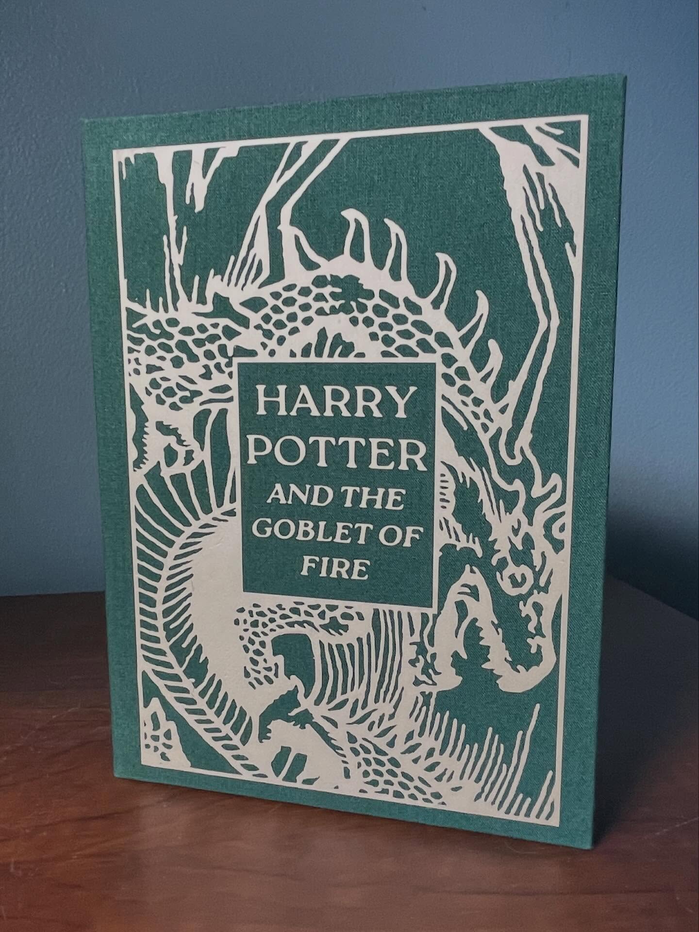 I promise I work! Sometimes I even remember to document.
This handsome little clamshell box went to its forever home yesterday. A much loved (perhaps much used) copy of The Goblet of Fire is going to avoid further damage inside this acid free enclosure.
Huge thank you to @oathboundbindery for their beautiful book cover design!
#bookrepair #paperrepair #bookbindersofinstagram #bookbinding #archival