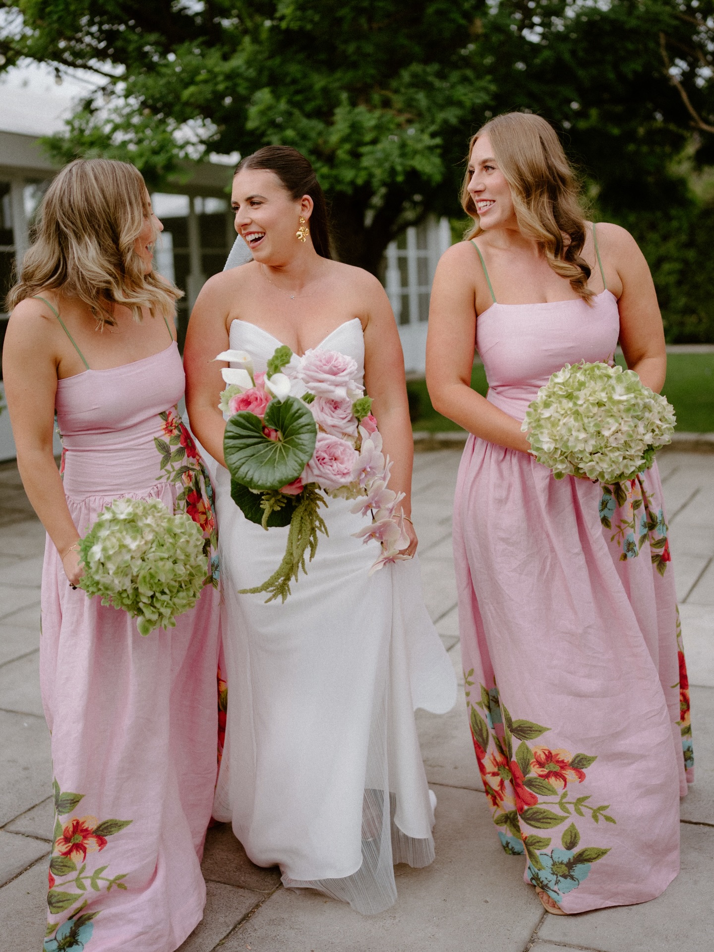 I absolutely adored these bridesmaids dresses, but won’t lie they can be a little tricky to work with as a florist. We don’t want to clash with the pattern, or take away from the dresses design.
For these bouquets we decided to make Emma’s bouquet super bougie, whilst keeping the bridesmaids bouquets simple posies of green hydrangea. This complemented the dresses, without looking chaotic.
I decided on green hydrangea for a few reasons. It picked up the green pattern on the dress, and tied into the green floral elements Emma requested in her bouquet. It also worked in the green tone suits the guys were wearing.
I love creating a curated design, that’s well thought out and intentional. My brains constantly ticking with thoughts for upcoming weddings, or how I’m going to make a colour palette work. It’s so much more than throwing flowers together 😂
Pics @dancartwrightphotography
venue @ravensthorpe.estate
Hair and makeup @bridalglowco
Suits @mjbale
Co-ordination/ planner @planned_by_page
