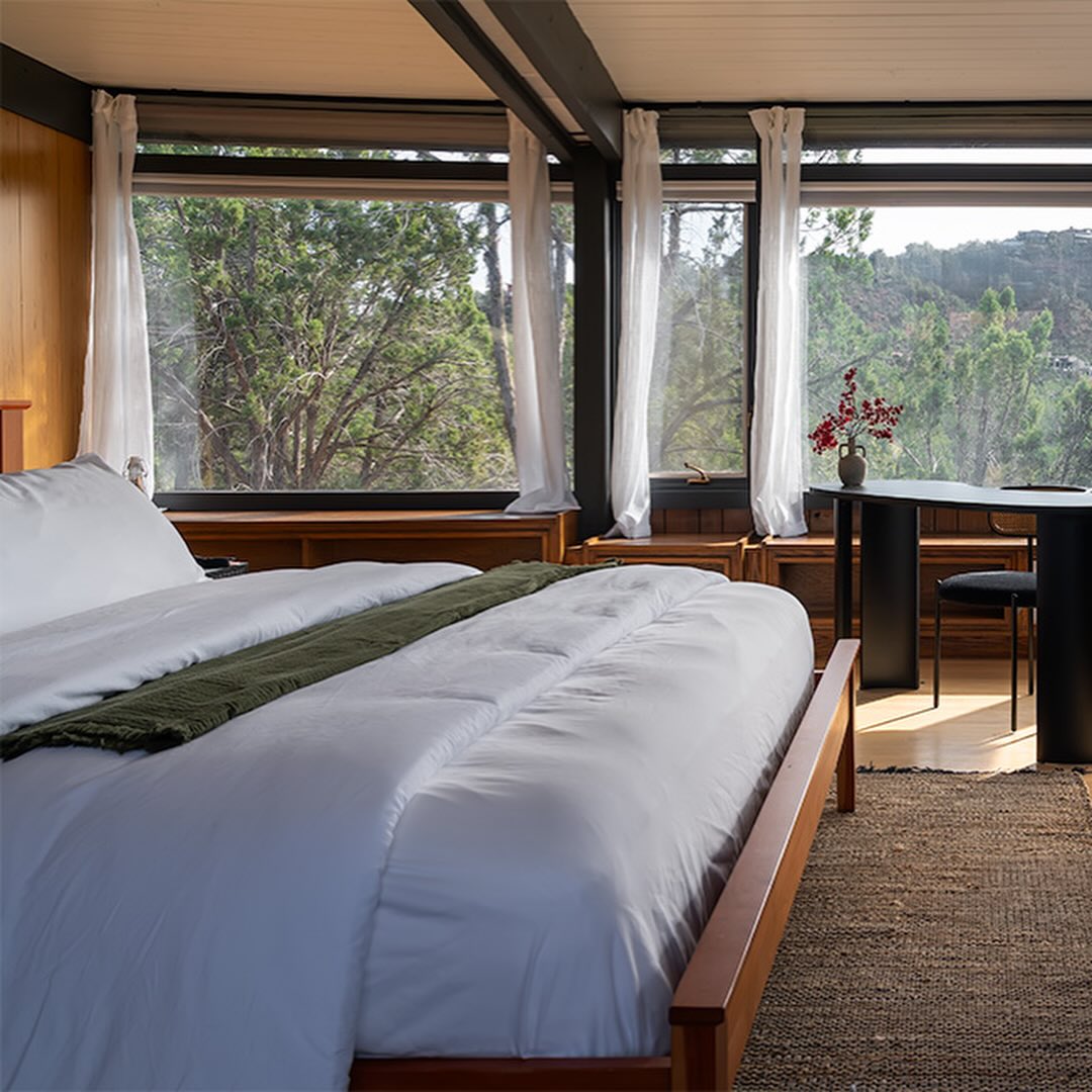 Surrounded by floor-to-ceiling desert views, the Stone Suite is the crown jewel of the main house and our most spacious, romantic offering. Wrapped in glass, the room feels immersed in nature—inviting you to witness Sedona’s landscape from sunrise gold to star-filled nights.
Unwind beside your private fireplace, the perfect companion for quiet evenings and deep rest. The suite’s spa-inspired bathroom features both a standing shower and a soaking tub, designed for slow, restorative rituals.
Every element of the Stone Suite is curated for connection, comfort, and a truly unforgettable retreat experience.
#AWellnessEstate #TheJenesisHouse #sedona