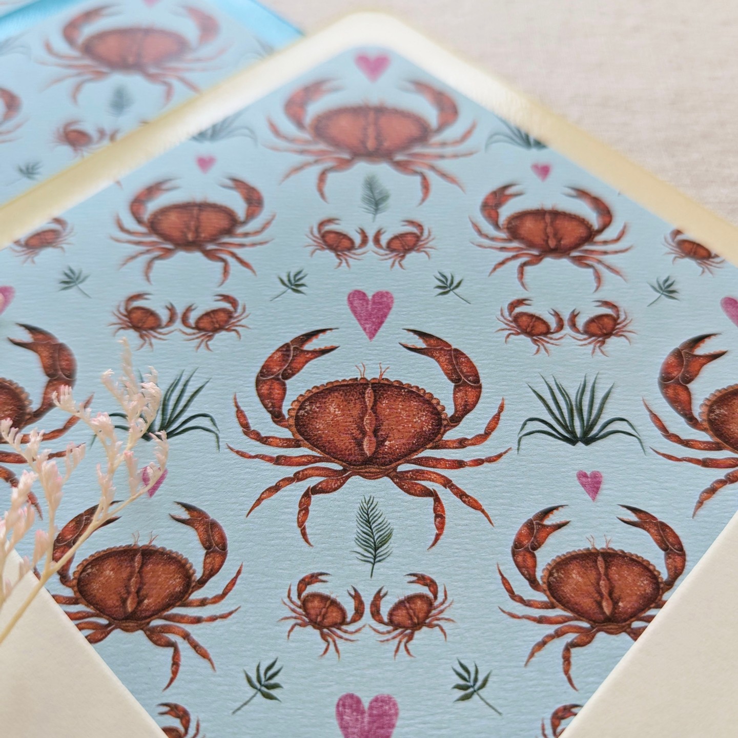 Dive into ocean bliss with this unique envelope liner! Featuring speckled crabs surrounded by swaying seaweed and sprinkled with charming hearts, this liner is the perfect touch of coastal charm for any celebration. Whether you're planning a seaside wedding, a nautical-themed party, or a baby or bridal shower, this design will add a pop of colour and personality to your invitations.
#envelopeliners
#envelopeliner
#nauticalweddings
#oceanwedding
#crabenvelopes
#crabinvitation