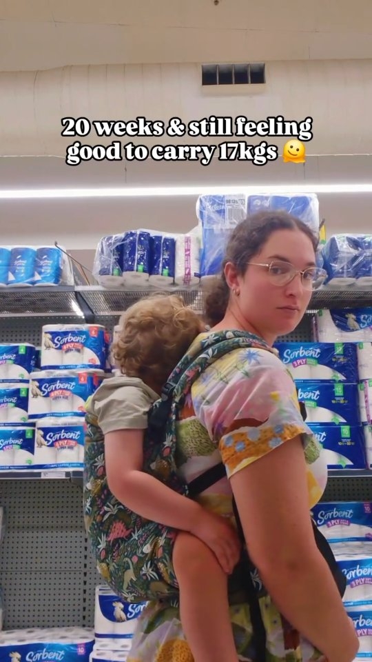 Fell asleep at the worst time and thankfully went back to sleep in the carrier, 2 minute nap was not enough 😴
Definitely notice the weight on my pelvic floor this week though so no long wears (maybe with a wrap or onbuhimo)
Ticks guidelines for safe babywearing:
Tight
In view
Close enough to kiss
Keep airways clear/ chin off chest
Supported spine
These look a little different with toddlers, and in back carry. But notice that he his up high, supported spine (J shape) with the tightened carrier, and no fabric in his face. He's not technically in view but old enough to respond or see on my camera. He's got my upper back to lean on to keep his head falling back, I do naturally lean forward slightly when back carrying if he's asleep which I don't need to but 🤷♀️
#babywearing #motherhood #postpartum