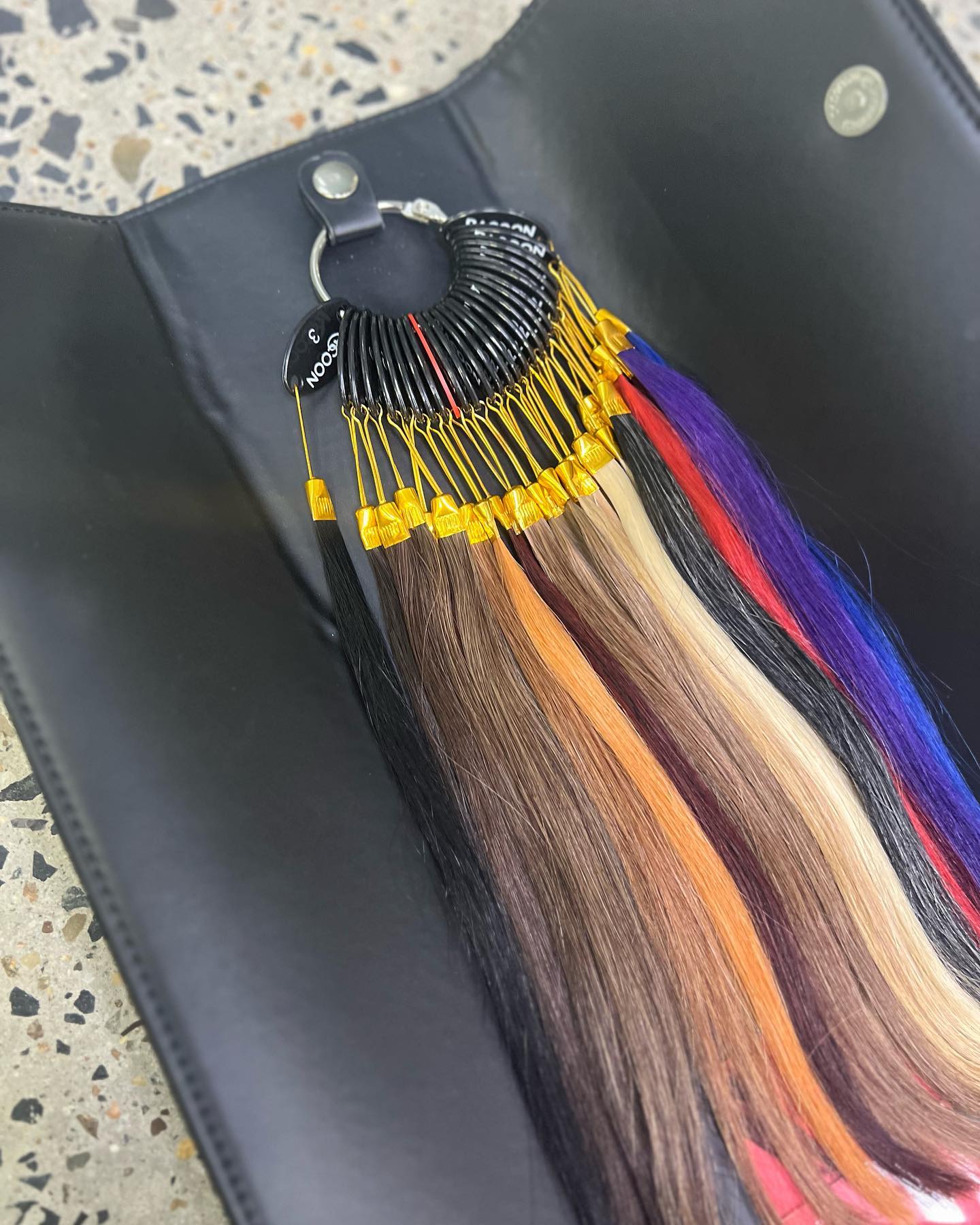 * NEW*
LOOKY HERE - THE LUXURIOUS LUXE HAIR, SWATCH WALLET ALERT 🚨‼️🔥
Did you know that our #luxebonds come in 29 different shades?
Our exclusive colour matching service also means salons can order bespoke blends of shades to match while allowing the client (and yourself because we can’t help it!) to feel the luxurious hair, because the swatches are made from our luxe premium hair 🥰!
To take it next level, we’ve given the swatch ring a cosy home inside a suede-finished wallet - pleather lined inside, padded all through to protect the hair, and the wallet closes into the perfect shape and size to store and show in style.
There are two available: one for our luxe premium hair, and another for our Luxe Links (inc single strand, double strand, and micro).
*Available to our stockists only.
*Wallet available to purchase separately if you are happy with your current search ring
DM to order yours or enquire about pricing! Lead time up to 6 weeks.