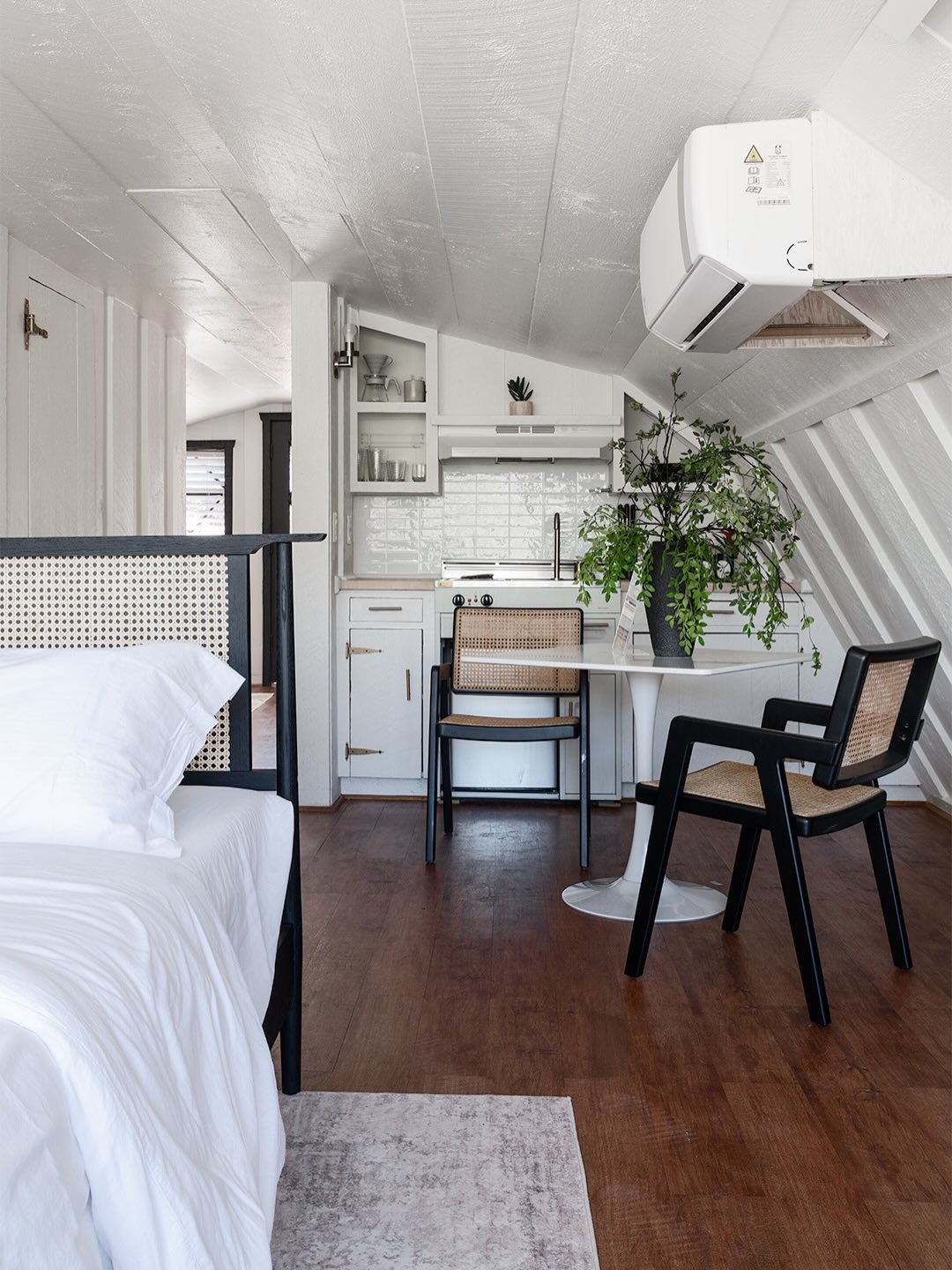 Light-filled and quietly tucked away, the Radiance Suite is a fully open, loft-style retreat set above the barn house, overlooking the labyrinth walkway and fragrant herb gardens. With its elevated position and airy layout, the space feels like a desert treehouse—peaceful, bright, and deeply connected to nature.The open-concept suite features a cozy kitchenette, a comfortable sitting area with an optional pull-out bed, and a shower–tub combination, making it ideal for retreat leaders, extended stays, or guests who appreciate spacious, flexible living.Every detail of the Radiance Suite is designed to support ease, creativity, and restorative living. #TheJenesisHouse #AWellnessEstate #Sedona