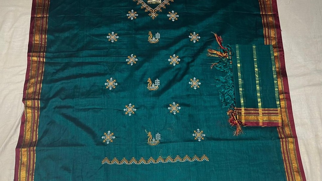 Kasuti Irkal dress materials
Price: Rs. 1499/-
Available on website in 11 different colours.
Kasuti Irkal dress materials are a fusion of Karnataka's traditional Kasuti embroidery and Irkal weaving. They feature intricate, hand-stitched motifs like flowers and temples on cotton fabric, with bold, contrasting borders and vibrant colors.
The materials typically include an embroidered top, a plain bottom, and a woven dupatta with striking patterns. Ideal for festive or traditional occasions, these dress materials beautifully combine cultural heritage with elegance