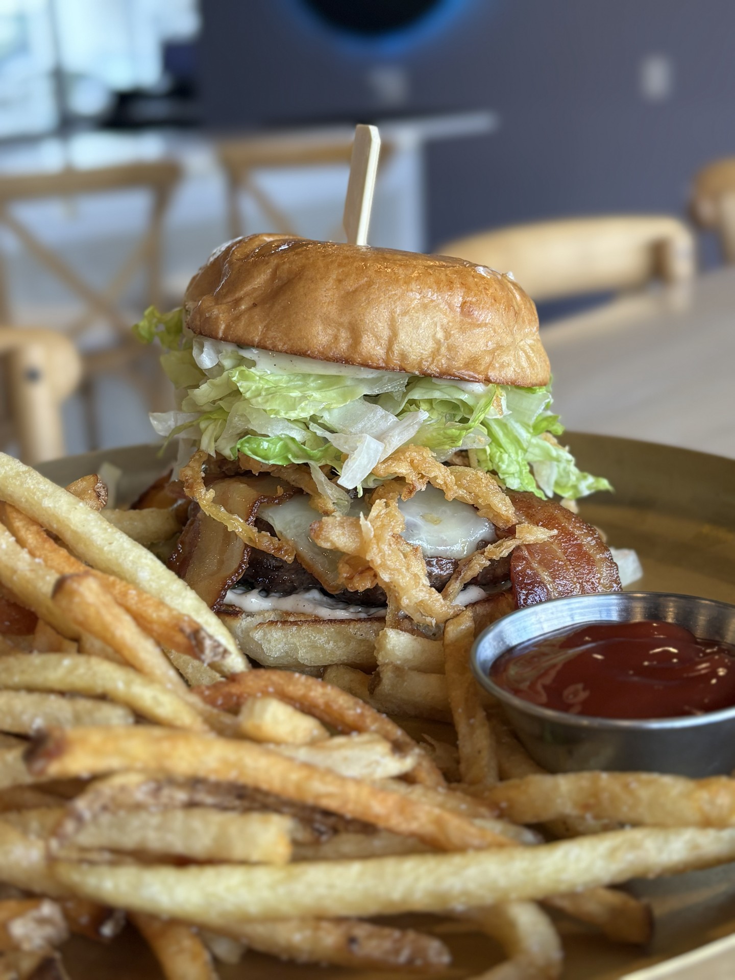 She's pretty. She's lil messy. She's the Blossom Burger, but don't underestimate! Smoked bacon, white cheddar, crispy onions, lettuce, truffle mayo, and house made pickles on a potato roll with shoestring fries. #potomacmd #thegrovebarandgrill #mocoeats