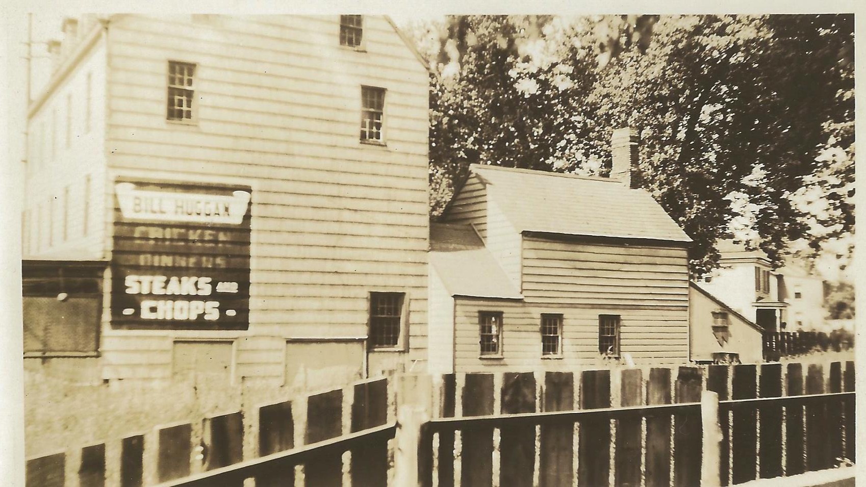 Here is a photograph of the museum in another life during the roaring 1920s! In this image, the viewer is looking south down St. Georges Avenue.
Bill Huggan rented the building and operated it as a restaurant and inn. It was *technically* not a tavern as he ran it during prohibition, a time when the sale and consumption of alcohol was illegal.
...But the building was raided twice for suspicion of being a speakeasy; once by federal agents and another time by Rahway's police force.
Yes, interestingly enough, despite these two raids, the illegal booze was never found... on the premises.
#njhistory #roaring20s #prohibition #speakeasy #rahway