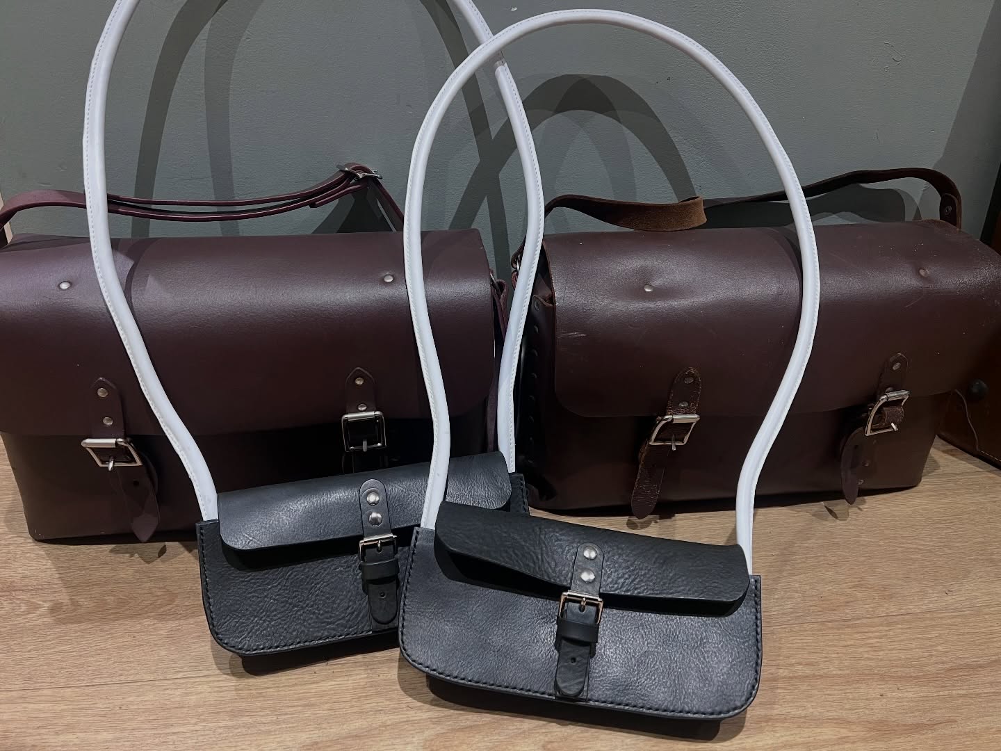 A quad of train bags for the @worthvalleyrailway Two guard bag repairs and two more brand new token bags keeping me busy of late.
It’s been a privilege doing work for these guys and it’s always fabulous learning about another sector as you find out more about the objects you work on.
In railway signalling, a token is a physical item that a train driver must possess or be shown before entering a specific section of single track. Each token is clearly marked with the name of the section it applies to. Token systems are most commonly used on single lines, where the risk of collision is higher if an error is made by the signaller or train crew, compared with double-track lines.
The final photo shows one in use @worthvalleyrailway #heritagerailway #trainguard #trainsofinstagram #traintokenbag #railway