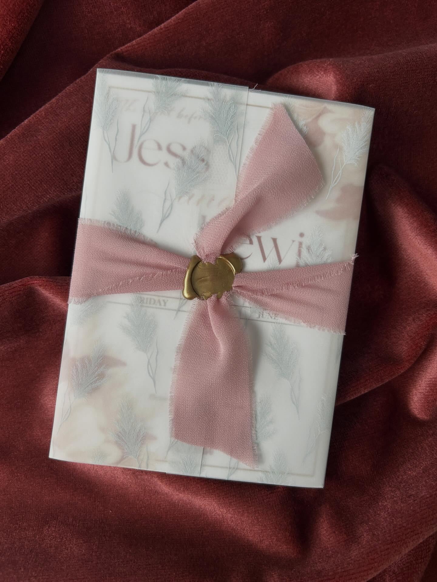 Soft layers, rich textures, and timeless romance.
This bespoke wedding invitation suite is backed with luscious suede, creating a beautifully tactile foundation, then delicately wrapped in a sheer vellum cover for an ethereal finish.
A blush pink chiffon ribbon adds softness and movement, while the gold wax seal brings a touch of old-world elegance ā the perfect final detail to complete the piece.
An invitation designed not just to be opened, but to be felt.
#LuxuryWeddingInvitations #VellumWeddingInvites #SuedeWeddingInvites #WaxSealInvitations #FineArtStationery BlushWeddingDetails BespokeWeddingStationery DesignsByNeevAndYana