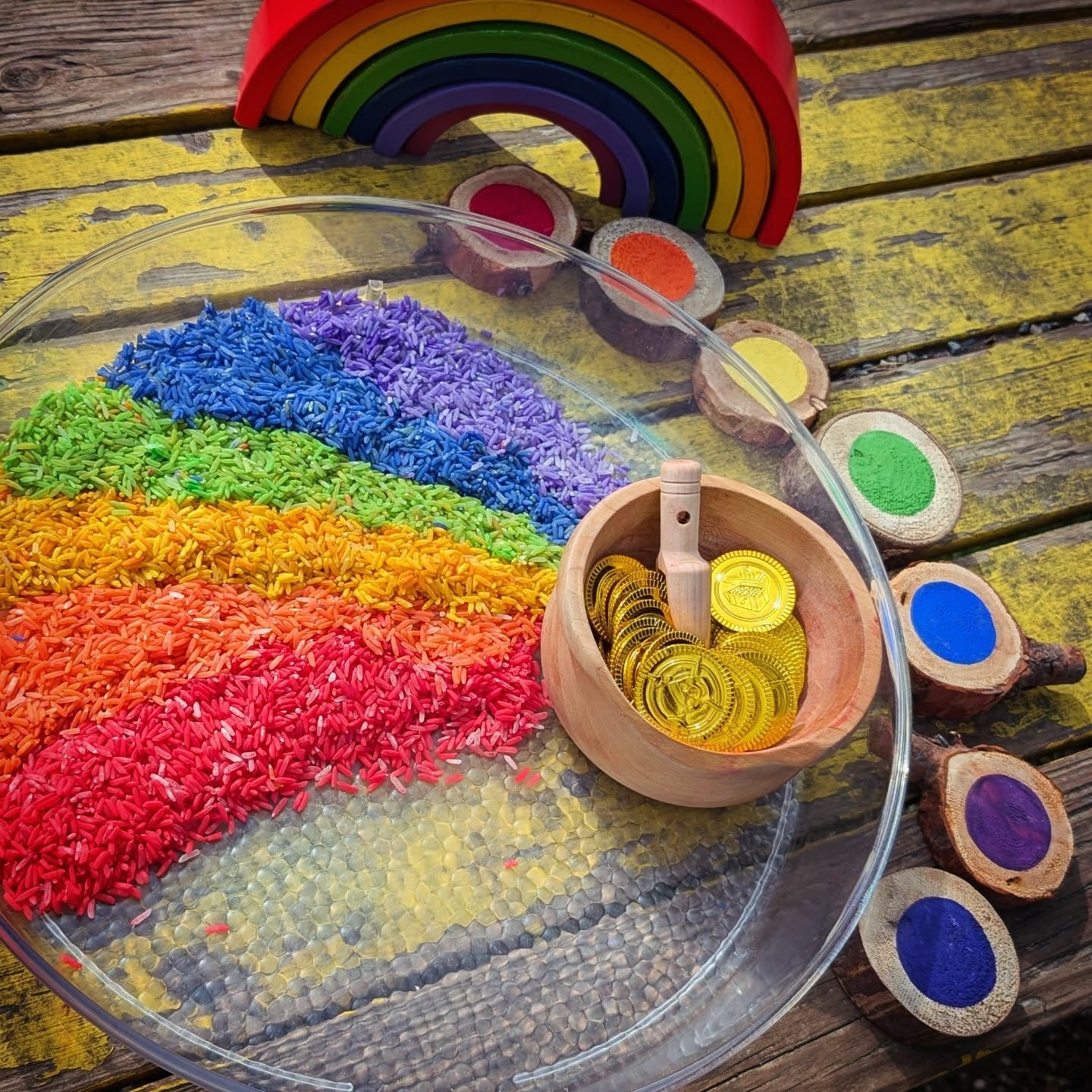 Although this setup was simple, it brought great joy to the children as they played outside in the sunshine.
Through mixing and matching Forest Learning Tools Rainbow Rounds, counting coins, scooping and sorting rice, they engaged in hands-on activities that sparked their curiosity and creativity. Their playful imagination even led them to “steal” the leprechaun’s gold, transforming ordinary play into a rich, meaningful experience.
This kind of play fosters cognitive skills, social interaction, and emotional development, highlighting the importance of simple, purposeful activities in childhood growth.
#earlylearning #RainbowRounds #rainbowplay #eceresources #LearningThroughPlay