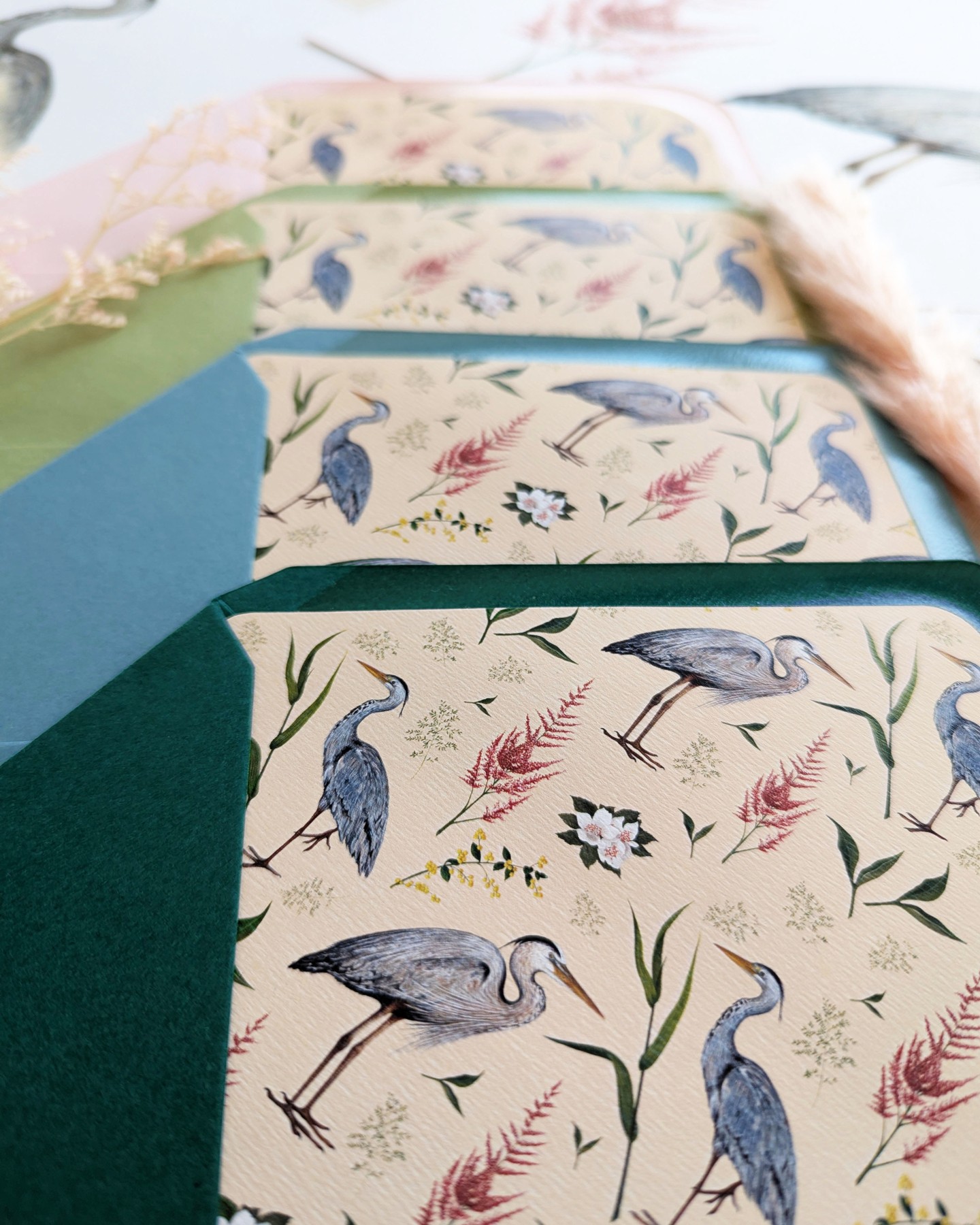 This delicate envelope liner will transport you to a beautiful lakeside location surrounded by majestic herons, reeds and flowers. The liner evokes the magic of the outdoors, bringing a touch of the natural world to every invitation. The overall effect is one of tranquility, making it the perfect complement to a whimsical country or lakeside celebration.
#envelope
#envelopeliners
#envelopeliner
#countrywedding
#lakewedding
#invitation
#handpainted