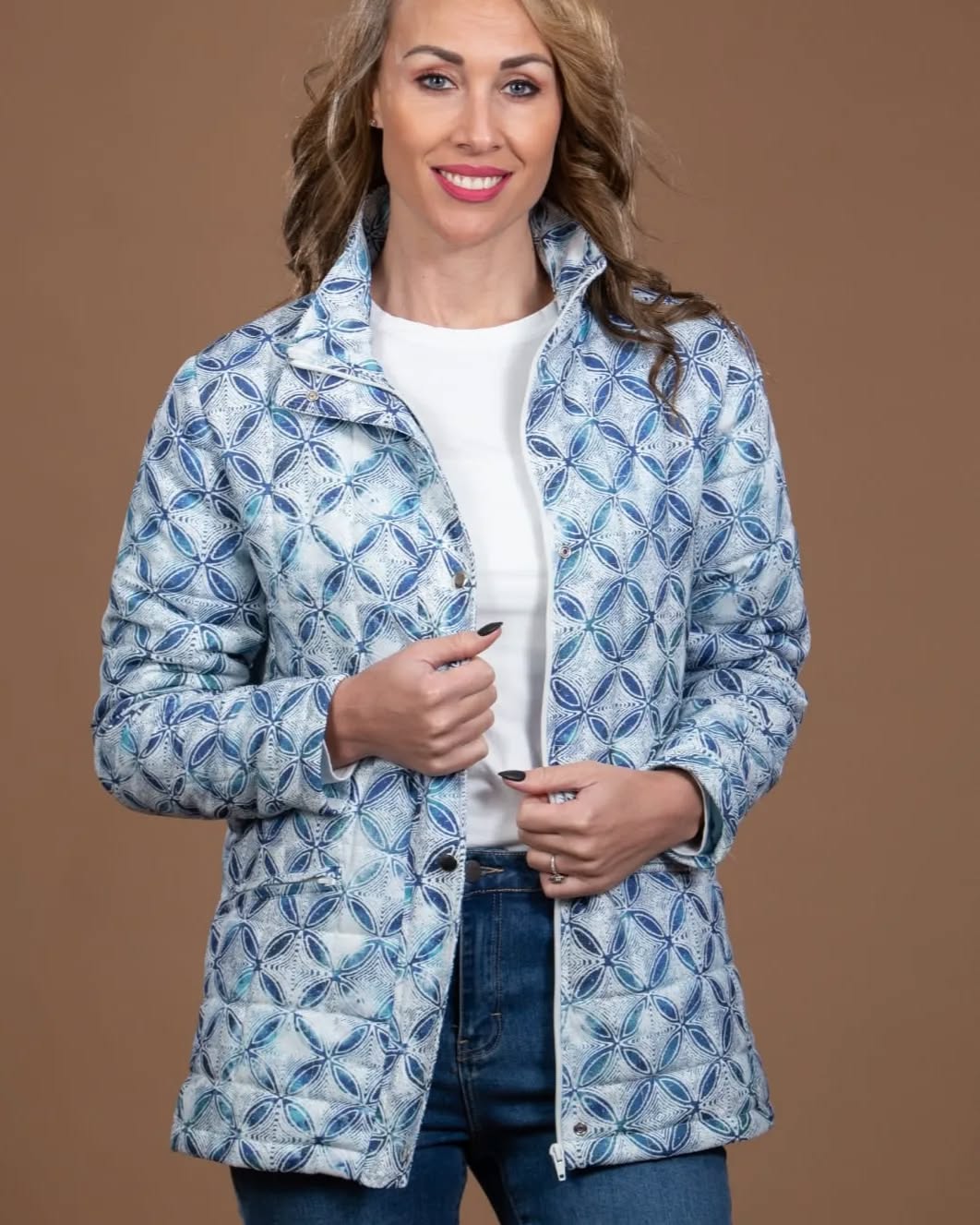 Warm quilted jacket in blue and pink print. #Anna's Boutique