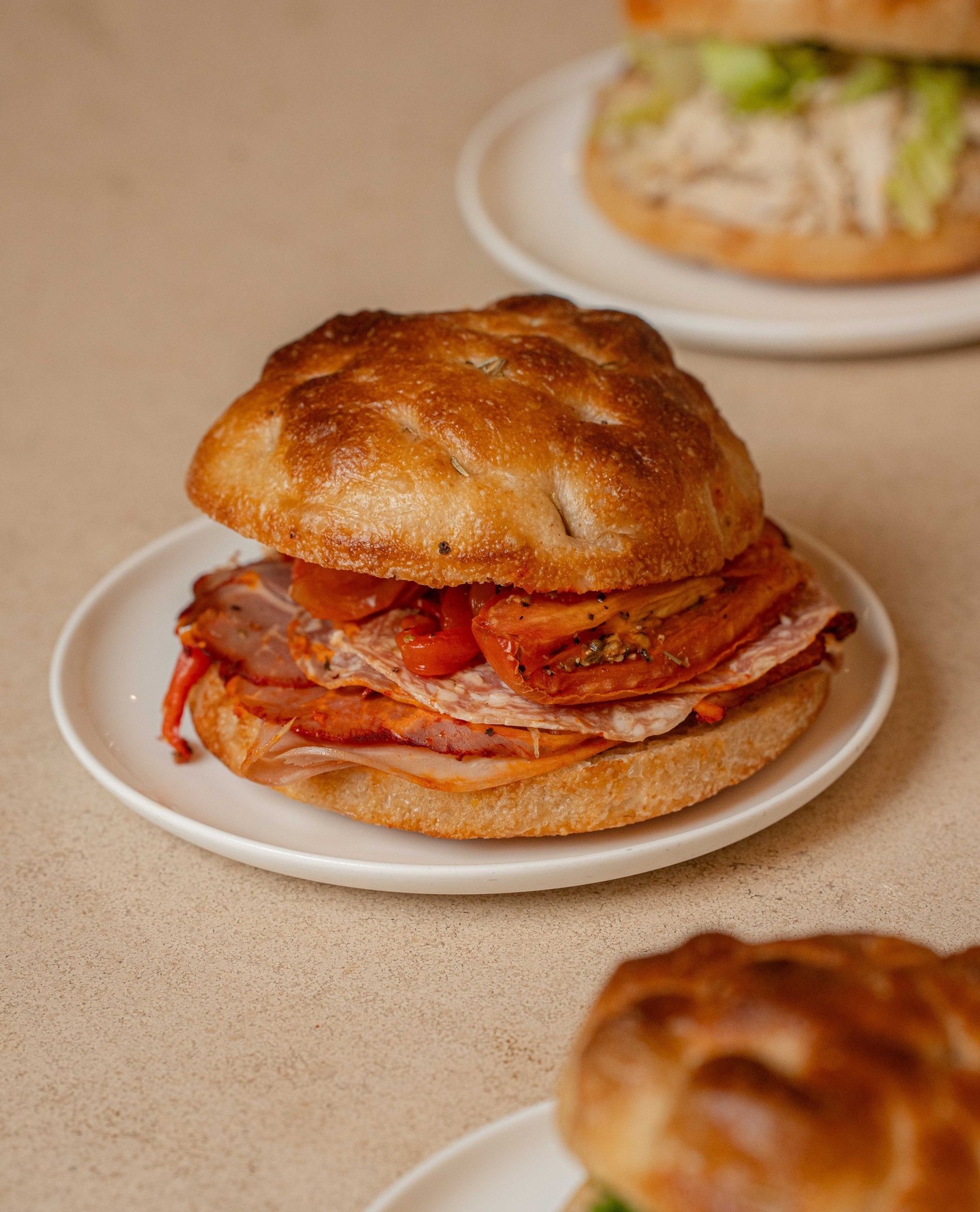 Our house-made focaccia, two ways.
Classic Italian: Roasted red peppers and Italian meats.
Vegan Chickpea Masala: Avocado, pickled red onions and masala mayo.
#SVBakery #SmallVictoryBakery #Focaccia #ChickpeaSandwich #Italian
