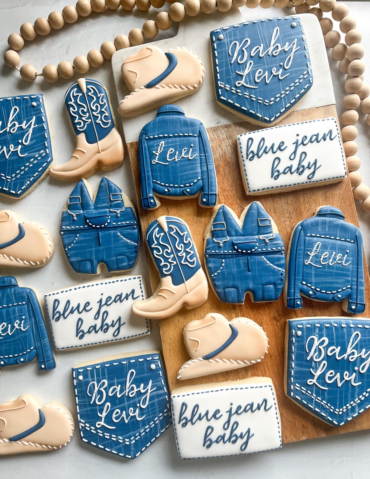 Two “blue jeans baby” sets in one month! 💙 Swipe to see the 2 versions 👖
.
.
.
.
.
.
#nashvillecookies #bluejeanbabycookies #bluejeanbaby #denimcookies #babyshowercookies