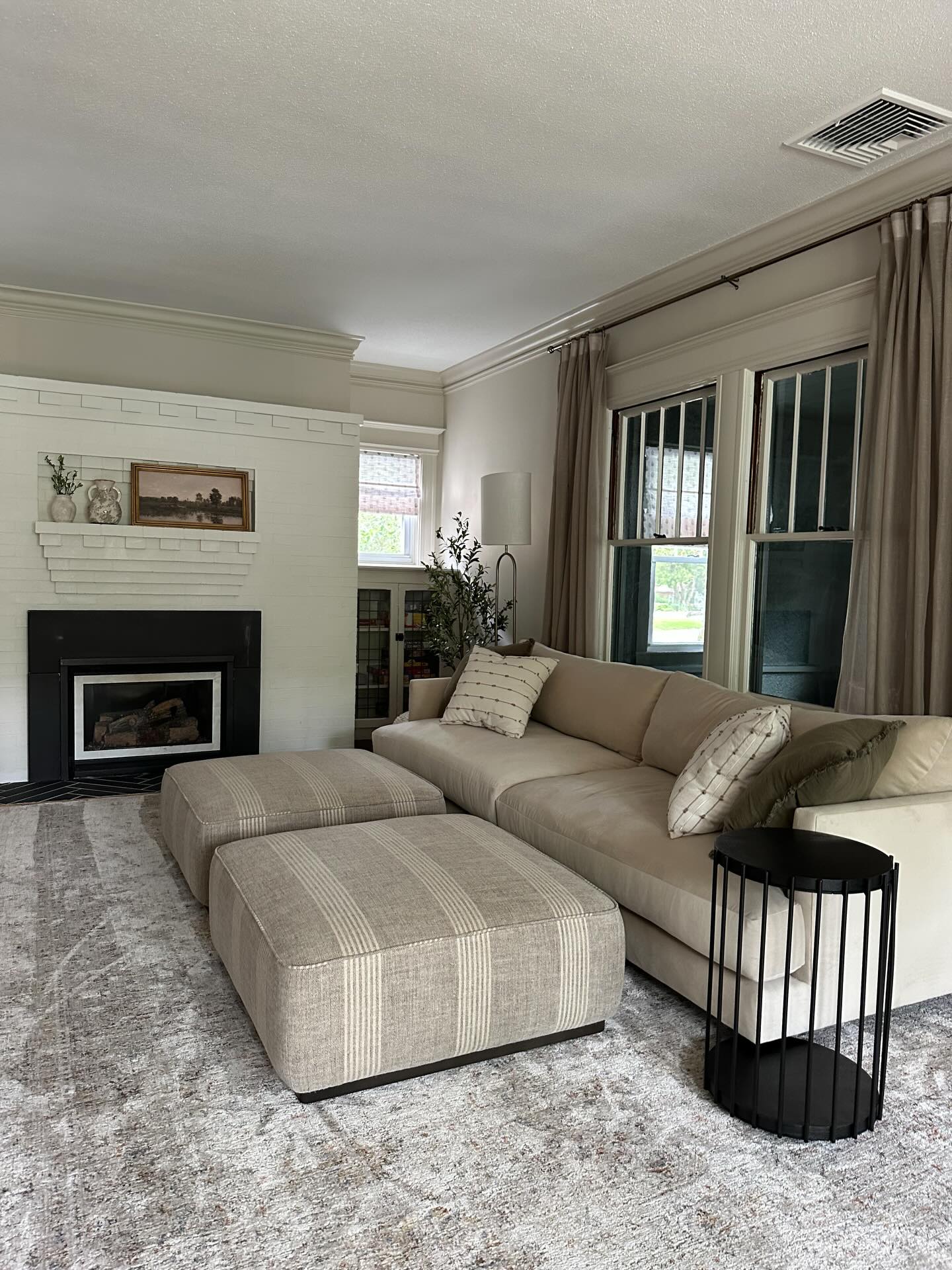 Another transformation in this gorgeous early 1900’s home. I love how we can see the matching Roman shades in the moody green office behind. Swipe to see the before.
.
#twopageschallenge #twopagesglowup #timelessinteriors #romanshades #neutrallivingroom
@twopagescurtains